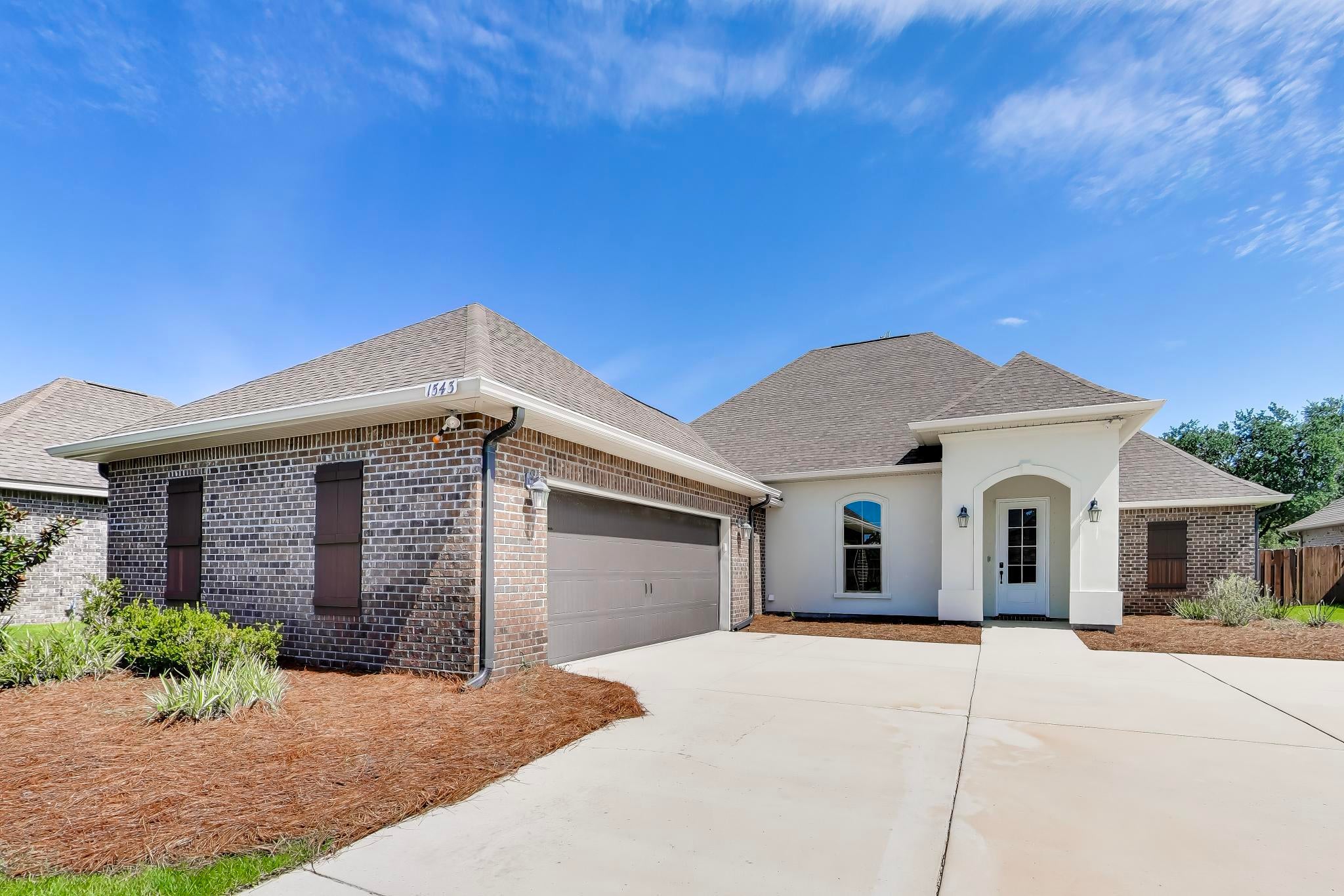 Move-in ready and loaded with upgrades! This stunning 4 bedroom/3 full bath, one level home on a cul-de-sac in The Waters -- one of Gulf Breeze's most sought-after communities -- is the Florida lifestyle you've been waiting for!  Step outside to your private backyard oasis featuring a resort-style inground/gunite pool, gas fire pit and heated spa with waterfall, ozone filter system, screened back patio, as well as new sod with a full irrigation system.  Inside, enjoy an open/split floor plan with high ceilings, the primary bedroom and an additional bedroom both have full en-suite bathrooms, quartz countertops in the kitchen and baths, stainless appliances, gas range, gas fireplace, wood-look, tile flooring, new carpet, fresh paint, a tankless gas water heater, and an ac unit to cool the finished garage with a built in drop zone at entry. A security system and smart home features add peace of mind. Perfectly situated between Pensacola Beach (15 min) and Navarre Beach (15 min), it's also just minutes to NAS Pensacola and Hurlburt Field, as well as convenient to grocery stores, shopping, and local dining.  Call your favorite Realtor today to see it -- this one won't last!