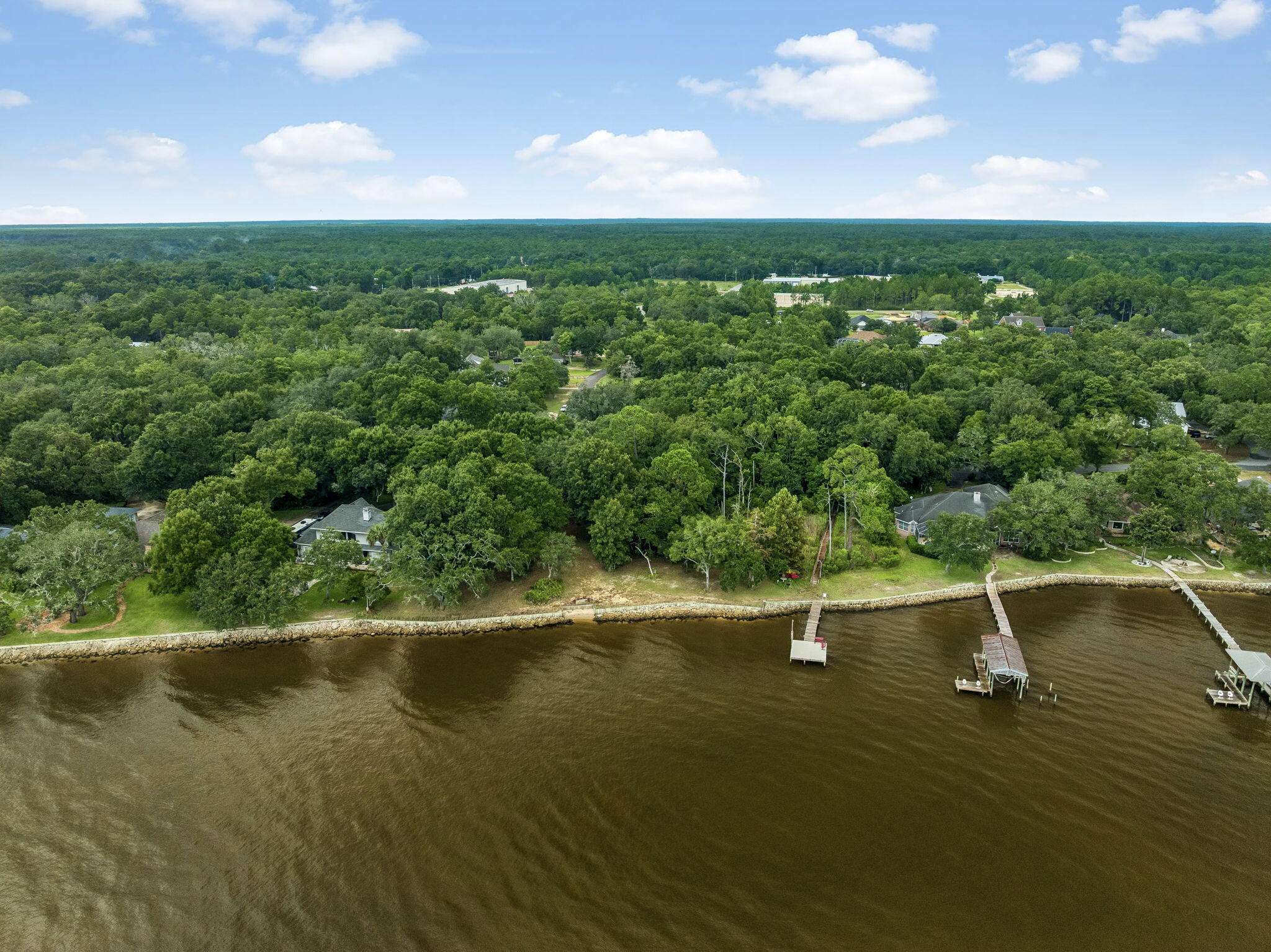 Discover a rare waterfront opportunity in Cedar Beach, offering approximately 1.61 acres with 214 feet of combined waterfront frontage along the bay. Lots 9 and 10 provide a beautiful setting for a custom home, surrounded by mature trees and peaceful natural scenery. Recently bush hogged, the property offers a more open view of the homesite while preserving its natural character. A portion of the property includes wetlands, creating additional ecological interest and privacy. With paved road access, public water and electric available, this property offers an exceptional opportunity to create a private waterfront retreat in the Freeport area. Enjoy serene bay views, generous waterfront frontage and convenient access to nearby amenities. Survey available.