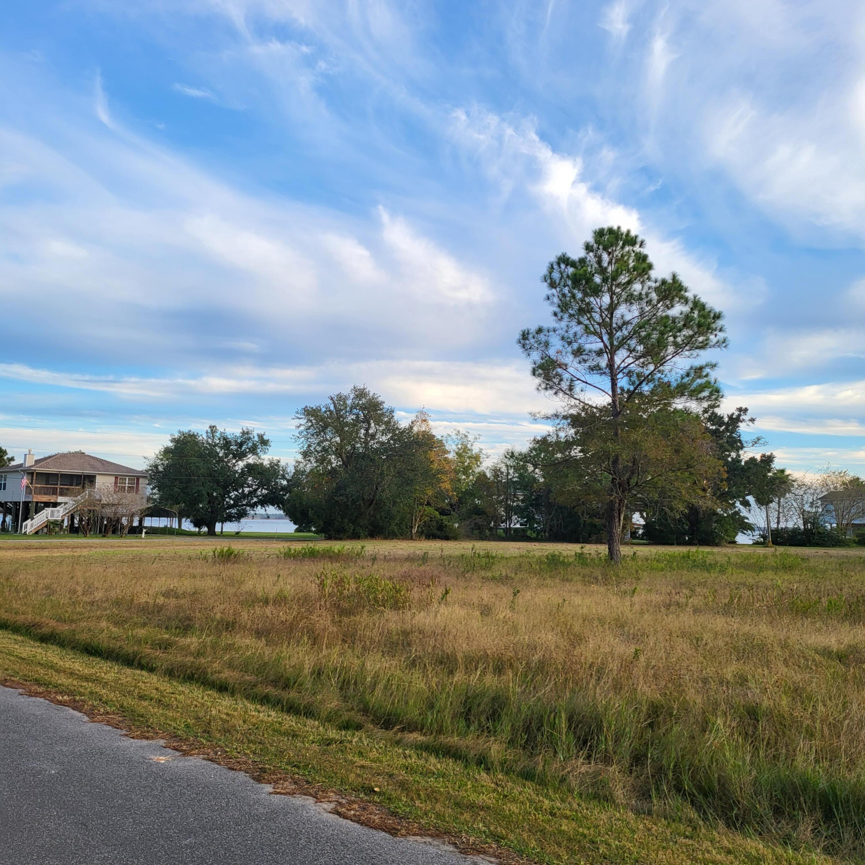 Just under .5 acre on Austin Dr.  with available adjoining lot with view of Blackwater Bay on Owensville Rd: TBD Owensville Rd., Milton FL. 32583, mls  1001176! It is conveniently located with in 10 minutes of I-10, 15 minutes of downtown Milton, and 25 minutes of Pensacola Airport and 50 minutes to gorgeous Destin Beaches! No Home Owner Association ! Splash RV Resort and Water Park down the road, and there is a marina less than a mile away. Flood Zone AE