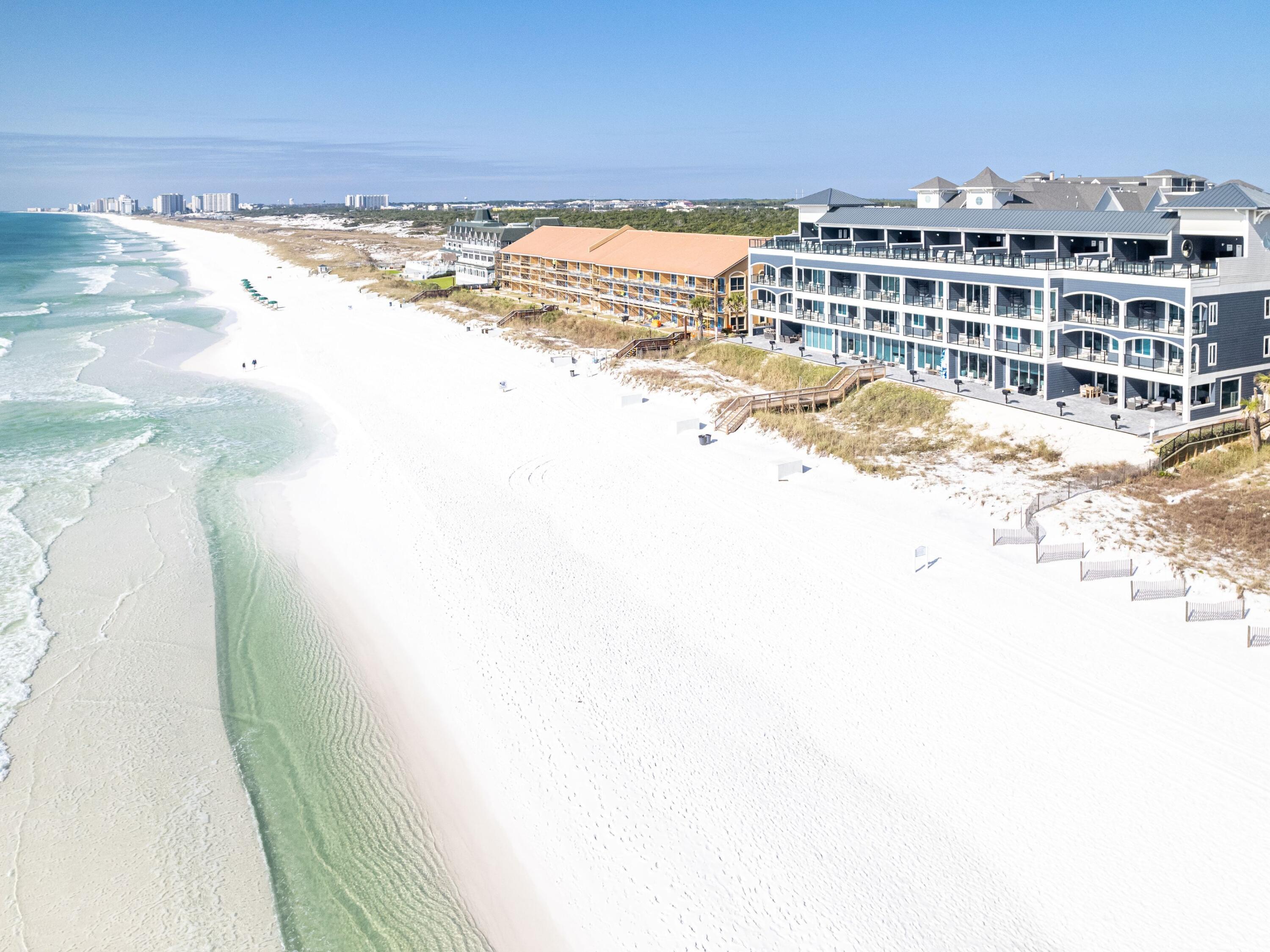 There is a certain confidence to a home that knows exactly what it is, and this gulf-front villa delivers it from the moment you arrive. With four levels of thoughtfully designed living, direct access to the sand and sweeping water views from nearly every floor, this residence offers the kind of beachfront experience buyers rarely find: polished, private and fully equipped for both personal enjoyment and high-performing rental potential.

Completed in 2021 as part of Destin's highly anticipated Henderson Beach Villas, this five-bedroom (easily converting to six with a potential bunkroom) residence spans approximately 3,032 square feet and places the beach at center stage at every opportunity. Step straight out to the sand from the expanded 102-sq.-ft. ground-floor patio, or take in the changing colors of the water from balconies and outdoor living spaces framed with see-through glass railings. At the top, a 658-sq.-ft. rooftop deck creates a remarkable setting for sunset evenings, complete with a heated 9-by-16 gunite pool, covered cabana, and additional storage.

Inside, professionally designed interiors by Duce & Company Interiors pair durability with a refined coastal finish. Porcelain and hardwood floors run throughout the home, while high-impact retractable glass sliders, a 10-ft. first-floor ceiling, custom shaker cabinetry and a sophisticated mix of quartz, marble and quartzite surfaces elevate the kitchen and baths. Sub-Zero and Wolf appliances anchor the kitchen, and an in-unit elevator makes all four levels easily accessible.

This villa was designed for comfort as much as style. A private theater and game room add another layer of livability, while extensive soundproofing includes dual acoustical panels and firewalls between units, soundproofing between floors, and sound mats beneath every level. The home is also pre-wired for Control4 smart home operation and includes a full-home sound system.

Recent updates further enhance functionality and peace of mind, including a complete pool refinish with plumbing, waterproofing of the pool basin, a finished attic floor for additional storage and surge protectors installed on the AC units. A UniFi enterprise-grade network system with wiring and cameras services the entire property and allows Wi-Fi coverage throughout the home and onto the beach.

With private deeded beach access, community grilling stations, gated beachfront entry, a private beach walkover, two dedicated parking spaces plus five additional guest spaces and short-term rentals allowed, this 10-unit gulf-front offering is as compelling for investment as it is for lifestyle. Elegant, highly functional and positioned directly on the sand, this is beachfront living with real presence.