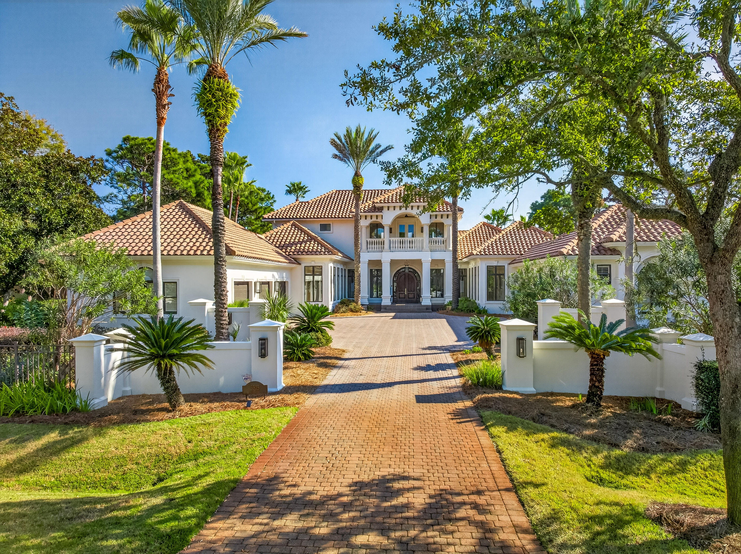 Tucked away in the prestigious and secluded Burnt Pine community within Sandestin Resort, this extraordinary 5-bedroom, 6.5-bath estate offers over 6,171 square feet of refined living space, plus approximately 2,000 additional sqft of covered decks, porches, and lanai--thoughtfully designed for both grand entertaining and everyday comfort. Enjoy breathtaking lake and golf course views, including stunning sunrise vistas across the water, from multiple vantage points throughout the home. Inside, the residence showcases custom-crafted mahogany doors, an elegant and flowing floor plan, and thoughtful updates throughout. A smart home lighting system enhances both convenience and ambiance, allowing effortless control of lighting to complement every moment features updated cabinetry, a Sub-Zero refrigerator, and premium finishes, making it ideal for hosting gatherings or enjoying family meals. Luxury amenities abound, including a bar, rebuilt wine cooler, whole-home sound system, media room, and a private gym creating an exceptional lifestyle experience. The primary suite is a true private retreat, offering a steam shower, towel warmer, and motorized drapes, delivering a spa-like atmosphere in the comfort of home. Upstairs, two spacious bedrooms offer stunning outdoor connections one with a charming Juliet balcony and the other with a generous balcony showcasing sweeping lake and golf course views. An upstairs loft office with custom bookcases provides a beautiful and functional workspace, while a large front-facing balcony enhances the home's impressive outdoor living. Outdoor spaces are equally remarkable, featuring a heated pool (heater approximately 5 years old), new pool motors, and expansive covered areas set against tranquil lake and golf course backdrops. A beautifully designed circular fire pit lounge sits on a brick paver patio, surrounded by curved cushioned seating and Adirondack chairs creating the perfect setting for sunset views, evening conversations, and entertaining under the stars amid mature palms and pine trees. A separate guest house offers added privacy and flexibility for visitors or extended family. Additional highlights include the 3-car garage that features a convenient motorized storage platform that raises to the ceiling at the push of a button, creating additional overhead storage space, tankless water heater, hurricane-rated doors and shutters, and an advanced sound system for seamless indoor and outdoor entertainment.

As an introduction to the Sandestin lifestyle, we invite our new owners to explore amenities that make Sandestin special. The listing brokerage and seller(s) are presenting the buyer(s) of this property with (2) 90-minute rounds of Tennis court time, a golf foursome at one of our three championship courses, and a round of golf for up to four (4) players at the unrivaled Burnt Pine Golf Club.

Sandestin Golf and Beach Resort features more than seven miles of beaches and pristine bay front, four championship golf courses, 15 world-class tennis courts, a 226-slip marina, a fitness center, spa and celebrity chef dining. Shop, dine and play at the charming pedestrian village, The Village of Baytowne Wharf and more. Inside the gates of the resort, residents enjoy a balanced lifestyle of high-class living, spanning the 2,400 acres from the beach to the bay. Everything within the gates of the resort is accessible by golf cart or bicycle. The entire resort is interconnected by miles of pedestrian, bike and golf cart paths that weave through groves of live oaks, meandering past natural lagoons, fountains, man-made lakes, and meticulously landscaped fairways.