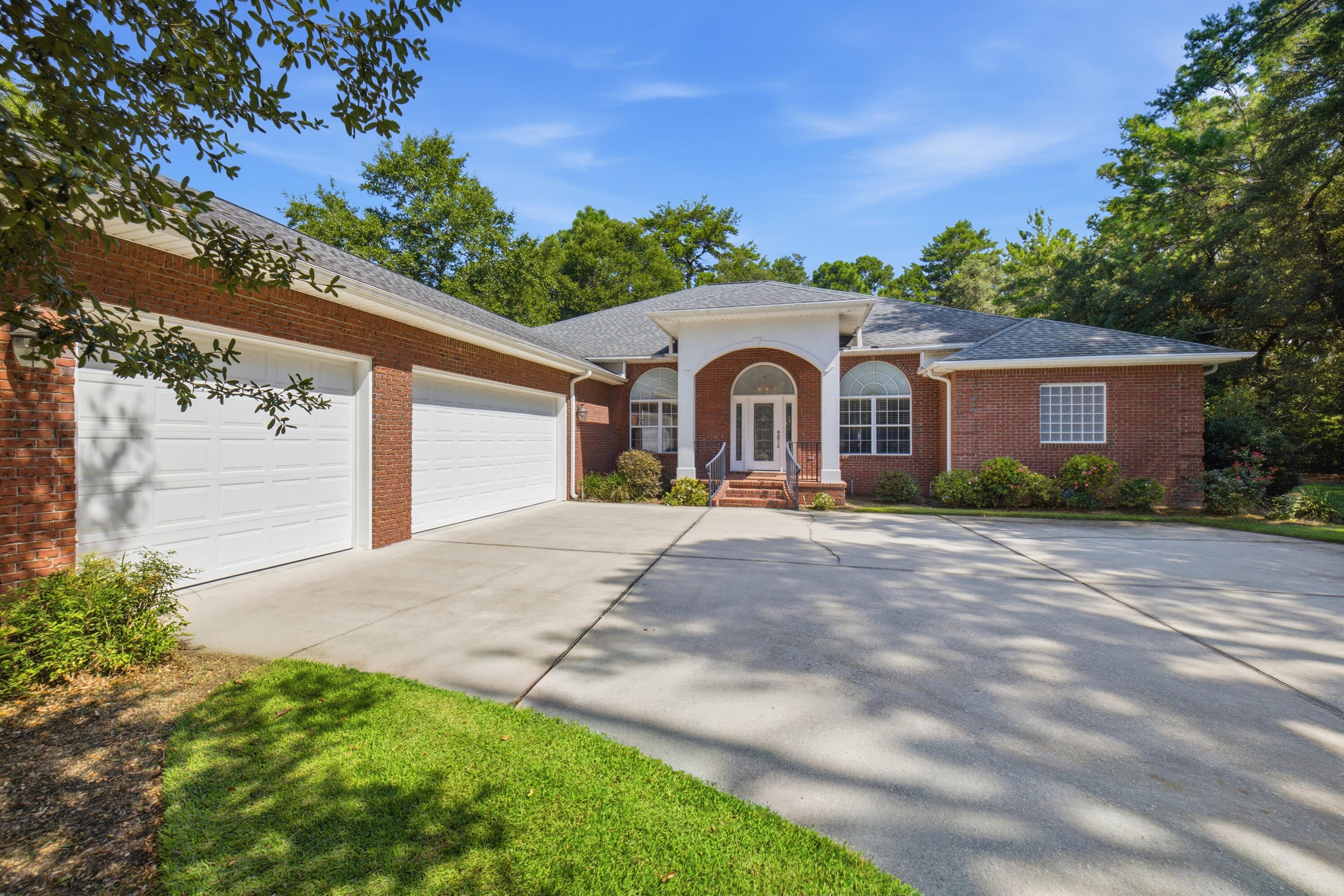 One of a kind, over 3000 square foot custom built, all brick home with four bedrooms, three full baths, a designated office, gorgeous dining room and a large chef's kitchen....did I mention the 720 square feet of screened porch overlooking the 17th tee at Rocky Bayou Country Club? High ceilings throughout, gorgeous crown with double crown molding, trey ceilings in most rooms, custom kitchen cabinets, granite counter tops, kitchen island, oversized master bedroom with a sitting area, a custom bath, huge shower, double closets & vanities and an oversized tub. Tile and hard wood through out the home. Large 3 car garage with extra garage door to park your golf cart (golf cart will convey with house).  This custom designed home with fully landscaped yard and sprinkler system has so many more ''extras'' that you need to see for yourself to appreciate. Call your favorite Realtor® today and make an appointment to see it before someone else makes it their own!