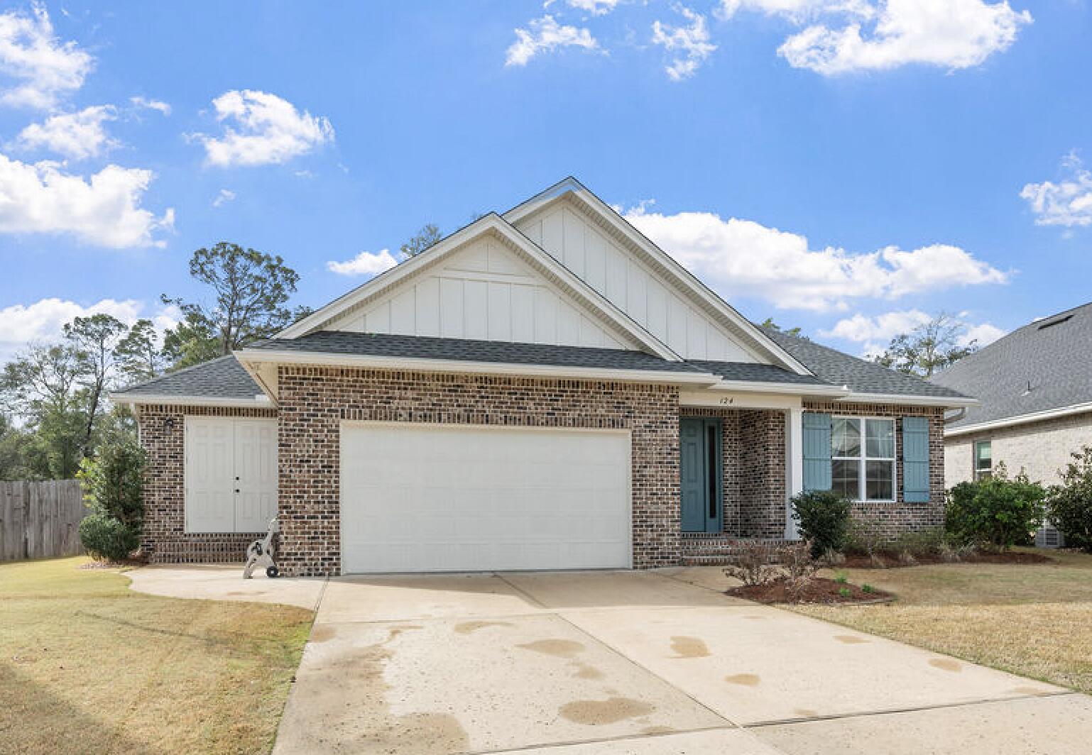 If privacy, upgrades, and maximizing space are at the top of your list, this 2021-built home delivers. Set on one of the largest lots in the neighborhood with no future homes behind it, this 4-bedroom, 2.5-bath property combines modern construction with thoughtful upgrades, flexible living spaces, and a backyard designed for both privacy and entertaining.
Inside, the open-concept layout features 10-foot ceilings, 8-foot doorways, and durable luxury vinyl plank flooring throughout the main living areas. The kitchen is designed for both everyday living & entertaining, highlighted by quartz countertops, tiled backsplash, warm soft-close cabinetry with under-cabinet lighting, and Bosch stainless steel appliances with an exterior-vented range hood. The upgraded pantry includes custom shelving, electrical outlets, and additional lighting for added functionality.
The primary suite offers a spa-inspired bathroom with double vanities, quartz countertops, a frameless glass shower, and his & hers closets. All bathrooms feature tile flooring and premium finishes.

Additional interior features include ceiling fans in every bedroom, TV and ethernet drops in each room, surround sound wiring, and dedicated electrical circuits in the eaves for holiday lighting.
The flexible floor plan includes a flex space with pocket doors that can serve as an office, playroom, or additional living area. A separate bonus area with its own exterior entrance and two electrical zones offers excellent potential for a workshop, home gym, hobby space, or climate controlled additional storage.

Outside, the oversized backyard offers privacy and space to relax or entertain with a paver patio and privacy fencing. fencing. A small, screened porch provides a comfortable spot to enjoy the outdoors while staying protected from the elements. The property also includes a sprinkler system with lawn pump and well for irrigation, gutters, small storage shed, flood lights, and a welcoming front porch. Additional features for peace of mind include a termite bond, impact rated windows, and wireless ADT self-monitoring security system.

Conveniently located near military bases, schools, hospital, local amenities, and Northwest Florida State College, this home offers modern construction, thoughtful upgrades, and a highly desirable location.