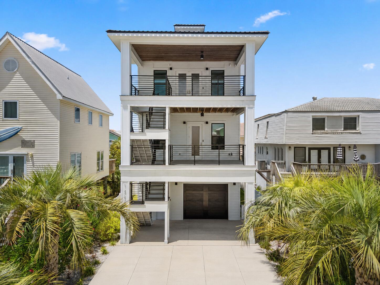 Welcome to one of Navarre Beach's most impressive custom-built coastal homes, where breathtaking water views, thoughtful design, and exceptional versatility come together in one unforgettable property. 

Perfectly positioned at the end of a quiet cul-de-sac with no HOA, this remarkable three-story residence offers unobstructed views of both Navarre Beach and the iconic Navarre Beach Bridge from multiple oversized balconies and expansive windows throughout the home.

Whether you're searching for a luxurious primary residence, an income-producing short-term rental, or the perfect second home along the Emerald Coast, this property delivers endless possibilities. Built just four years ago, every detail was carefully designed to maximize comfort, privacy, and the incredible surrounding scenery.

The ground level offers abundant garage space and multiple storage areas, providing plenty of room for beach gear, golf carts, water toys, and everything needed to enjoy the coastal lifestyle.

The second level features two spacious bedrooms, a full bathroom, an inviting living area, and a beautifully appointed kitchen overlooking the water. One of the home's most unique and valuable features is its thoughtful floor plan. The upper level is completely private, with no interior access from the second floor, making it ideal for multigenerational living or maximizing rental flexibility. (see continuation of story) The entire third floor serves as an incredible owner's retreat, complete with a spacious primary suite, luxurious bathroom, full kitchen, comfortable living room, and a private balcony where you can enjoy spectacular sunrises, sunsets, and refreshing Gulf breezes in complete privacy.

Outside, you'll appreciate the oversized driveway with ample parking, beautifully landscaped grounds with irrigation, mature trees and shrubs, and stunning composite staircases accented by sleek modern black railings that perfectly complement the home's contemporary coastal architecture.

Finding a custom-built beach home of this caliber this close to the Gulf without a multi-million-dollar price tag is becoming increasingly rare. Previously used only as a long-term rental, the home presents tremendous opportunities for investors while also serving as an exceptional full-time residence or vacation getaway.

Be sure to request the complete feature sheet to discover all of the custom upgrades and thoughtful details this remarkable property has to offer.

The Garage has a carve out room, and there is extra sound proofing throughout the house, Double layer, quiet walk installed under all floors, and double layer 5/8 drywall throughout as well!
This is more than a beach house....it's a lifestyle, an investment, and a rare opportunity to own a truly one-of-a-kind property on Florida's Emerald Coast.