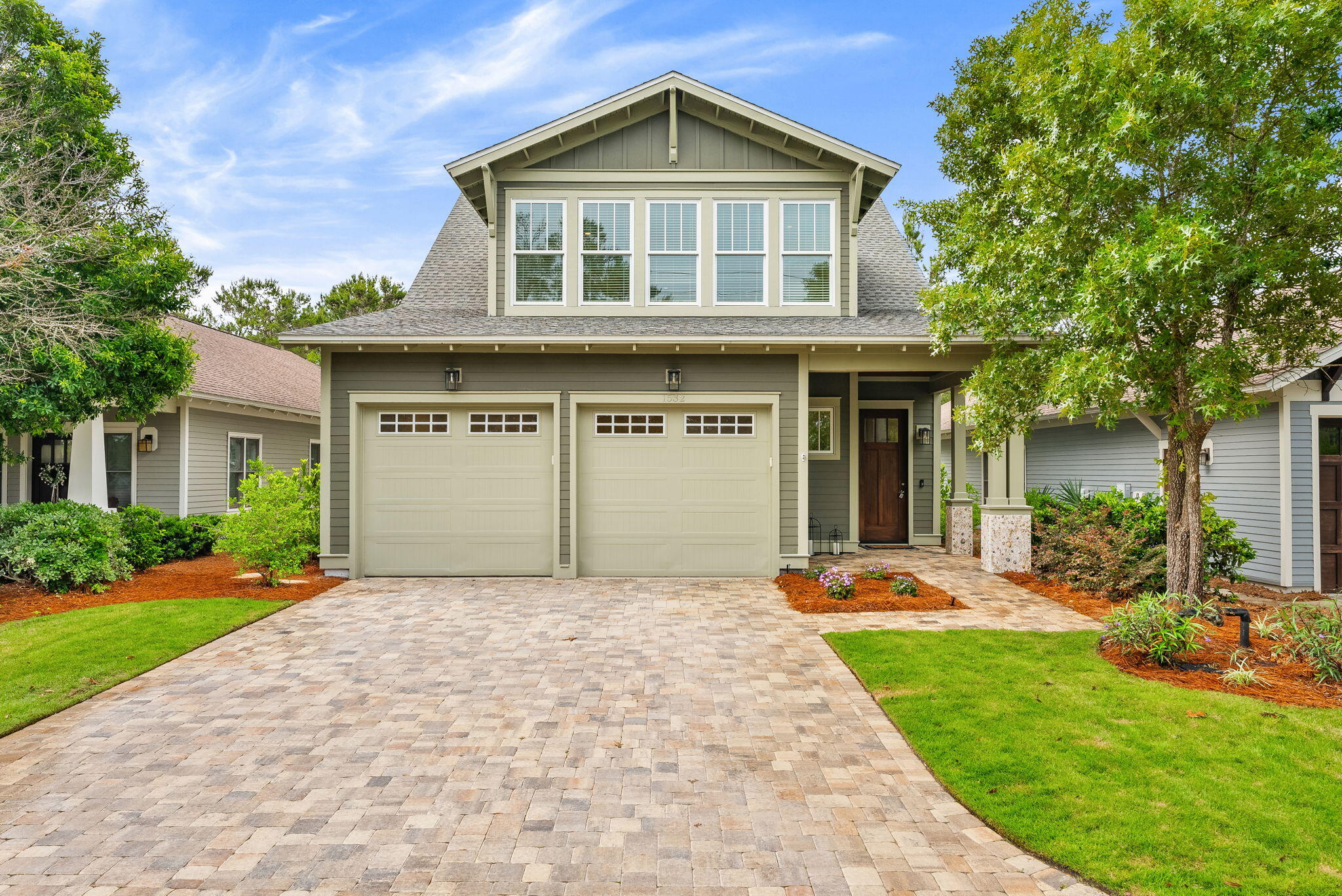 Welcome to luxury living in the heart of Wild Heron. Built in 2024 and impeccably maintained, this like-new 3 bedroom, 3 bathroom home offers exceptional craftsmanship, thoughtful design, and premium upgrades throughout. Situated along the 3rd hole of the renowned Sharks Tooth Golf Course, this home combines elegant interiors with a peaceful golf course setting. Inside, you'll find site finished hardwood floors, abundant natural light, and a bright open-concept floor plan designed for both everyday living and entertaining. The chef's kitchen features upgraded finishes, quartz countertops, custom cabinetry, and a spacious island overlooking the living and dining areas. The flexible floor plan includes a bonus room currently functioning as a butler's pantry and office, with the ability to easily convert back into a 4th bedroom if desired. The spacious primary suite offers a spa-inspired bath and a relaxing retreat feel, while the upstairs bonus living area provides additional space for guests, media, or hobbies. One of the standout features is the incredible amount of heavily insulated attic storage space, offering both energy efficiency and rare functional storage. Outside, enjoy the beautifully landscaped setting and all the amenities Wild Heron is known for, including gated entry, pools, fitness center, dock access to Lake Powell, and scenic walking trails. (Golf & tennis, with Watersound Club Membership). A rare opportunity to own a nearly new luxury home in one of Panama  City Beach's most sought-after gated communities.