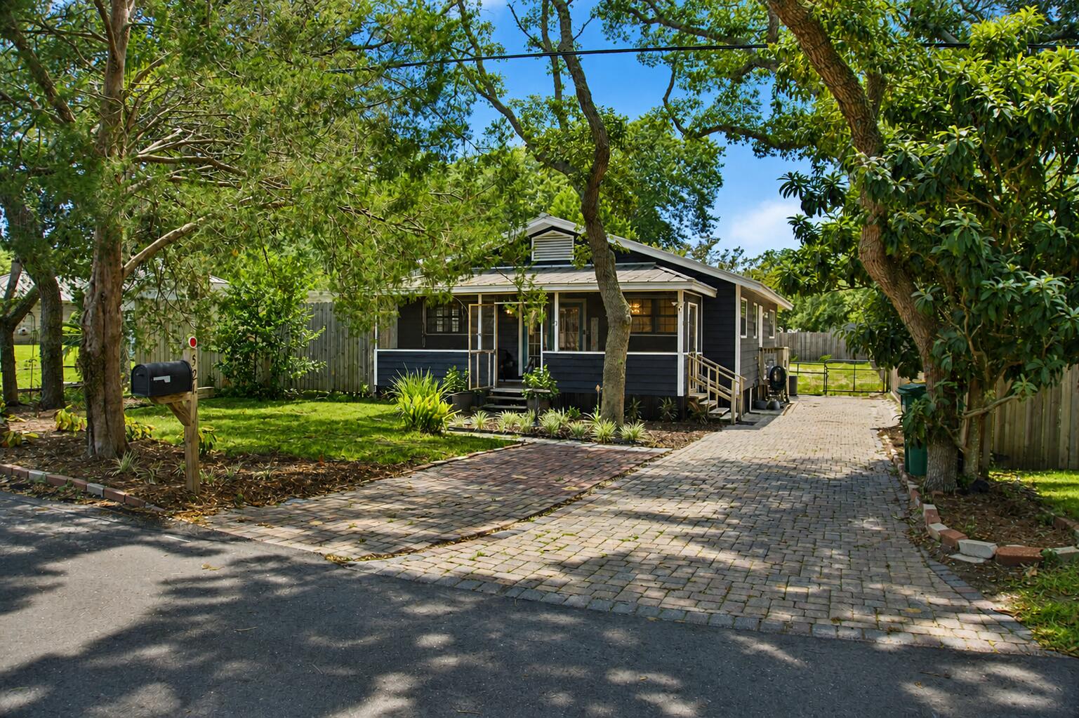 Welcome to 521 2nd Ave, a well-kept Destin cottage offering the laid-back coastal lifestyle buyers come here for. Situated on a spacious 0.24-acre lot with no association, this 2-bedroom, 2-bath home offers 1,254 heated square feet, tasteful updates, and excellent outdoor living. Inside, enjoy granite countertops in the kitchen and baths, stainless appliances, neutral finishes, hardwood and tile flooring, and a comfortable layout. The screened porch is perfect for morning coffee or relaxing after a day at the beach. Outside, mature trees, paver parking, a fenced yard, and a generous backyard provide plenty of flexibility. Water and electric are already set up for RV parking, and the home is wired for a commercial generator with 200-amp electrical service. Additional features include a metal roof installed in 2009 and recently serviced HVAC and water heater systems. Located near Joe's Bayou and just minutes from Destin Harbor, beaches, dining, shopping, and everyday conveniences.