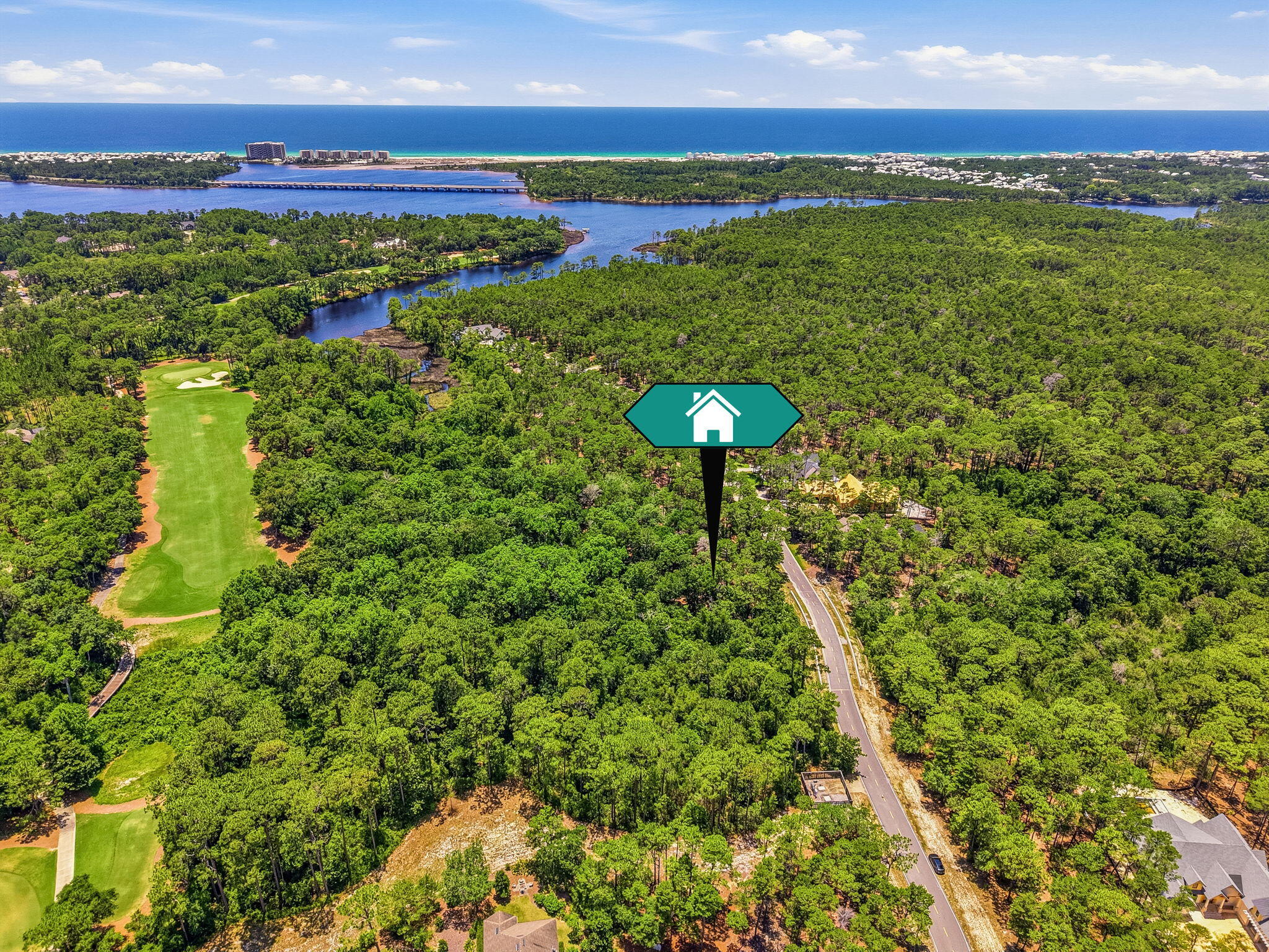 Tucked behind the private gates of Wild Heron, this exceptional homesite spans nearly half an acre and enjoys a serene setting bordered by lush natural vegetation along the renowned Shark's Tooth Golf Course. Encompassing more than 734 acres with frontage on the rare coastal dune Lake Powell, Wild Heron is celebrated as the coastal Sanctuary for its seamless blend of luxury amenities, distinctive architecture, and preserved natural beauty. Residents enjoy an unparalleled lifestyle where tranquil surroundings, championship golf, and the area's unique coastal ecosystem come together in perfect harmony.

Community amenities include a lakefront boathouse and dock, heated pool and hot tub, family park area, walking paths, health club, and lakeside fire pit. Residents also have the opportunity to access the Shark's Tooth Golf Course designed by Greg Norman and hydro-clay tennis facilities through a Clubs by Joe membership. NO short term or long term rentals allowed. Neighboring lot is for sale.