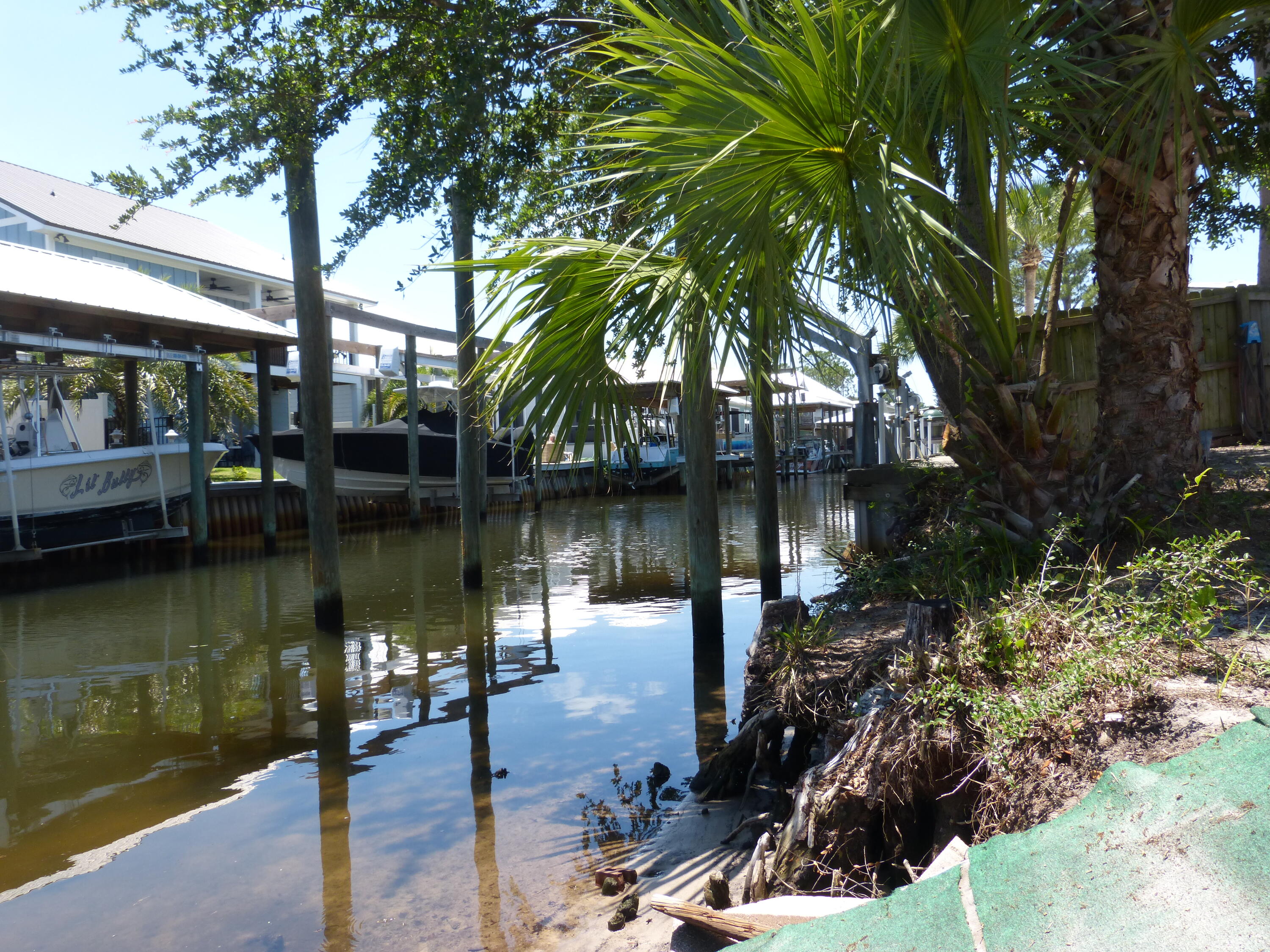 YOUR PRIVATE GATEWAY TO THE GULF IS HERE! This is the best-priced waterfront gem with Direct Gulf Access, look no more.  Immaculate & Refreshed: ''Fresh and Ready'' condition with updates throughout.  The Space: 3BR / 2BA + Den & Fireplace, Large Sun Filled Chef's Kitchen, Laundry Area all situated on a waterfront canal.  Outdoor Living: Huge screened porch & shade trees with gentle access to the water's edge, ample parking, RV's welcome.  Boater's Retreat: Deep canal for easy navigation to open water. We are open for offers, come see this well priced home of over 1500sf. 4 Dock pilings installed. Owner Financing Available. VA, FHA, and Conventional financing options are ready to go as well. Ask for our owner financing option, the monthly payment offered for principal and interest is under $2050/mo. You will be hard pressed to find a better home to buy. Call now, easy to show!
