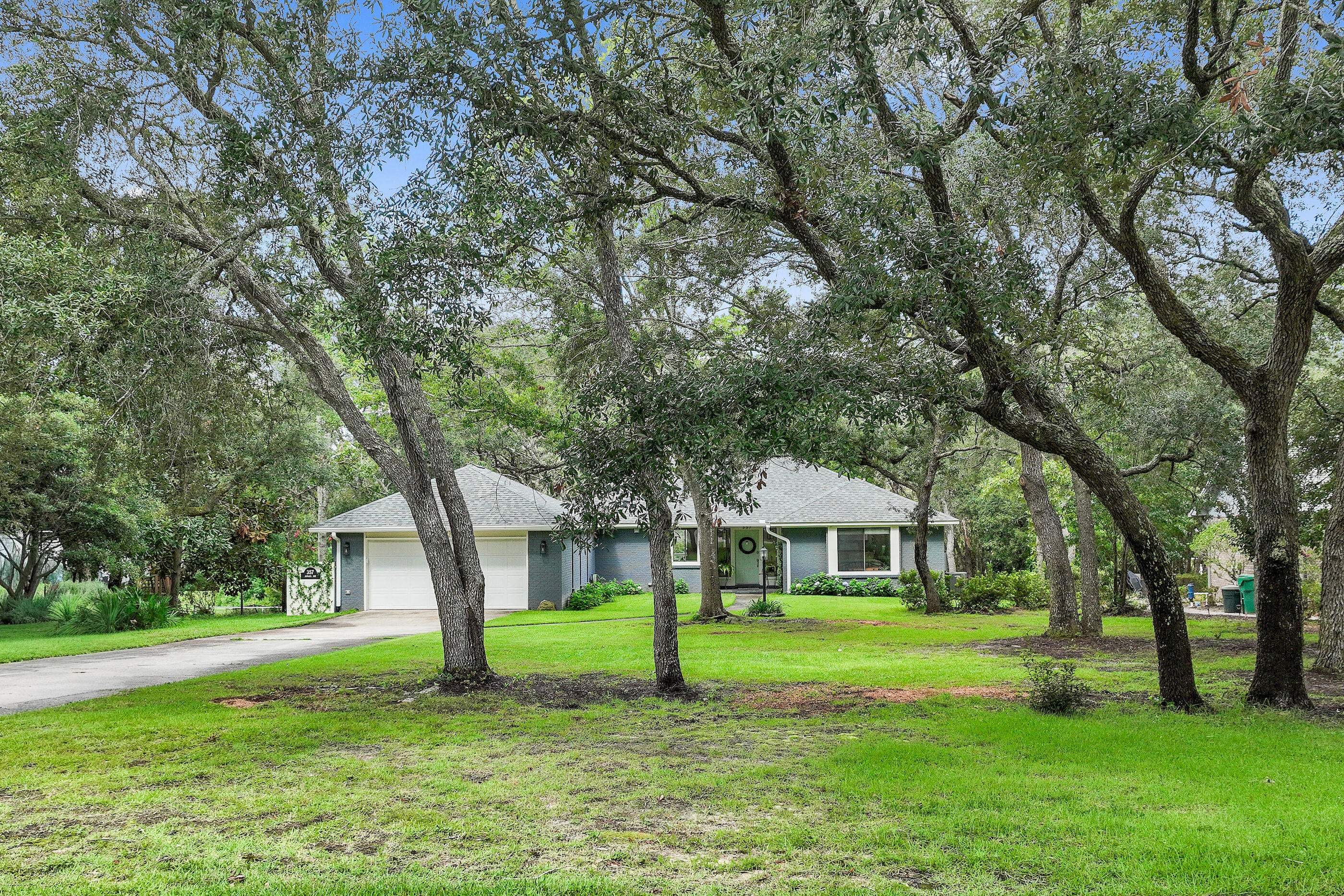 Completely renovated in 2024, this exceptional one-story ranch home sits on a large lot in the highly sought-after Bluewater Bay. Combining timeless charm with modern finishes, the home offers over-the-top updates, peaceful pond views, and a private setting beneath a canopy of mature oak trees.

The open-concept floor plan is designed for both everyday living and entertaining. At the heart of the home is a beautifully redesigned kitchen featuring a large island, all new cabinetry, stainless steel appliances, a gas range, and an elegant tile backsplash. The adjoining living area is anchored by a warm gas fireplace, while expansive windows and glass doors bring in natural light and frame views of the backyard.

The spacious primary suite serves as a private retreat with custom trim moldings. The luxurious ensuite bath features a very large, open tiled shower and high-end finishes. Two additional guest bedrooms are generously sized with large closets and can easily accommodate king-size beds. A versatile Florida room provides the perfect space for a home office, reading room, or additional living area, while the laundry room includes tons of storage, a new washer and dryer along with a convenient folding station.

Outdoor living is equally impressive. A large deck overlooks the tranquil pond, while the newly installed brick paver patio and fire pit create the perfect setting for relaxing evenings or entertaining family and friends. Tasteful landscape lighting enhances the backyard long after sunset.

The extensive 2024 renovation includes a new roof, water heater, flooring, interior and exterior paint, lighting, a completely remodeled kitchen and bathrooms with new cabinetry, countertops, tile, and all new appliances. The fireplace, range, and water heater have all been converted to natural gas, providing both efficiency and convenience.

Bluewater Bay is one of Niceville's premier master-planned communities, known for its tree-lined streets and exceptional amenities. Optional membership provides access to a marina with boat slips and storage, waterfront dining, golf, tennis, swimming pools,pickleball and tennis courts and playgrounds. The home is also conveniently located just minutes from the white-sand beaches of Destin, excellent shopping and dining, top-rated schools, and Eglin Air Force Base.

All information contained in the MLS is believed to be accurate; however, buyers should verify any information they deem important, including room dimensions and square footage.