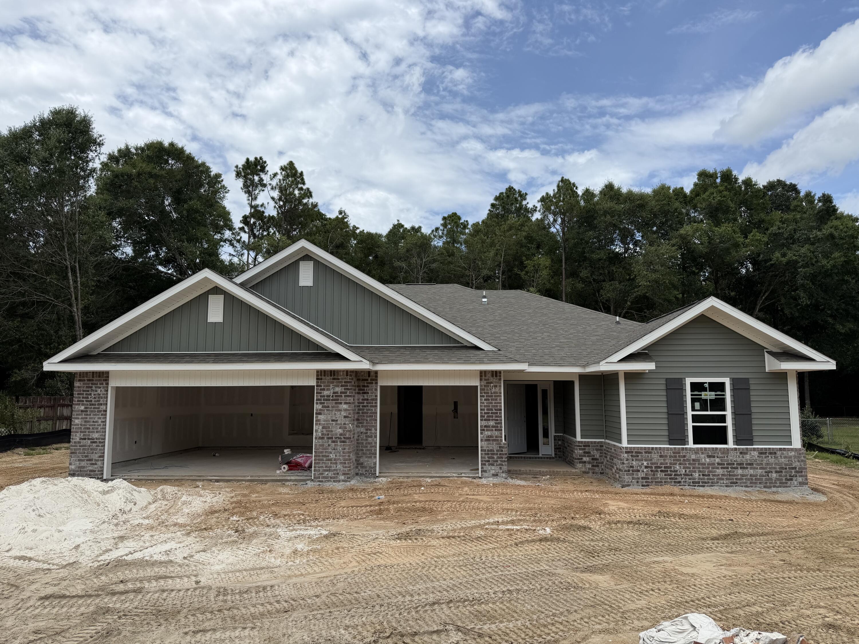*New Construction - Anticipated Completion Nov 2026 * Lot Size 100 x 300 * 2 x 6 Exterior Construction * 3 Car Garage *$15K Your Way Incentive on this Home (certain restrictions apply) * Split BR Plan: 4BR/3B * 10 ft Ceilings in Main Living Areas * Wood Plank Laminate Flooring throughout - No Carpet * Tile in all Baths * Kitchen: Granite Countertops & Large Island, Shaker Style Soft Close Cabinetry, Stainless Steel Appliances & Walk in Pantry * Main Suite: Trey Ceiling & Main Bath with Zero Entry All Tile Walk in Shower with 2 Shower Heads, Separate Soaking Tub, Dbl Vanities & Walk-in Closet * Ceiling Fans: Bedrms, Family Rm & Covered Rear Lanai * Granite Countertops all Baths * J & J Bath w/ Dbl vanities * Finished Garage & Pull Down Attic Stairs * Covered Entry * Irrigation * No HOA *