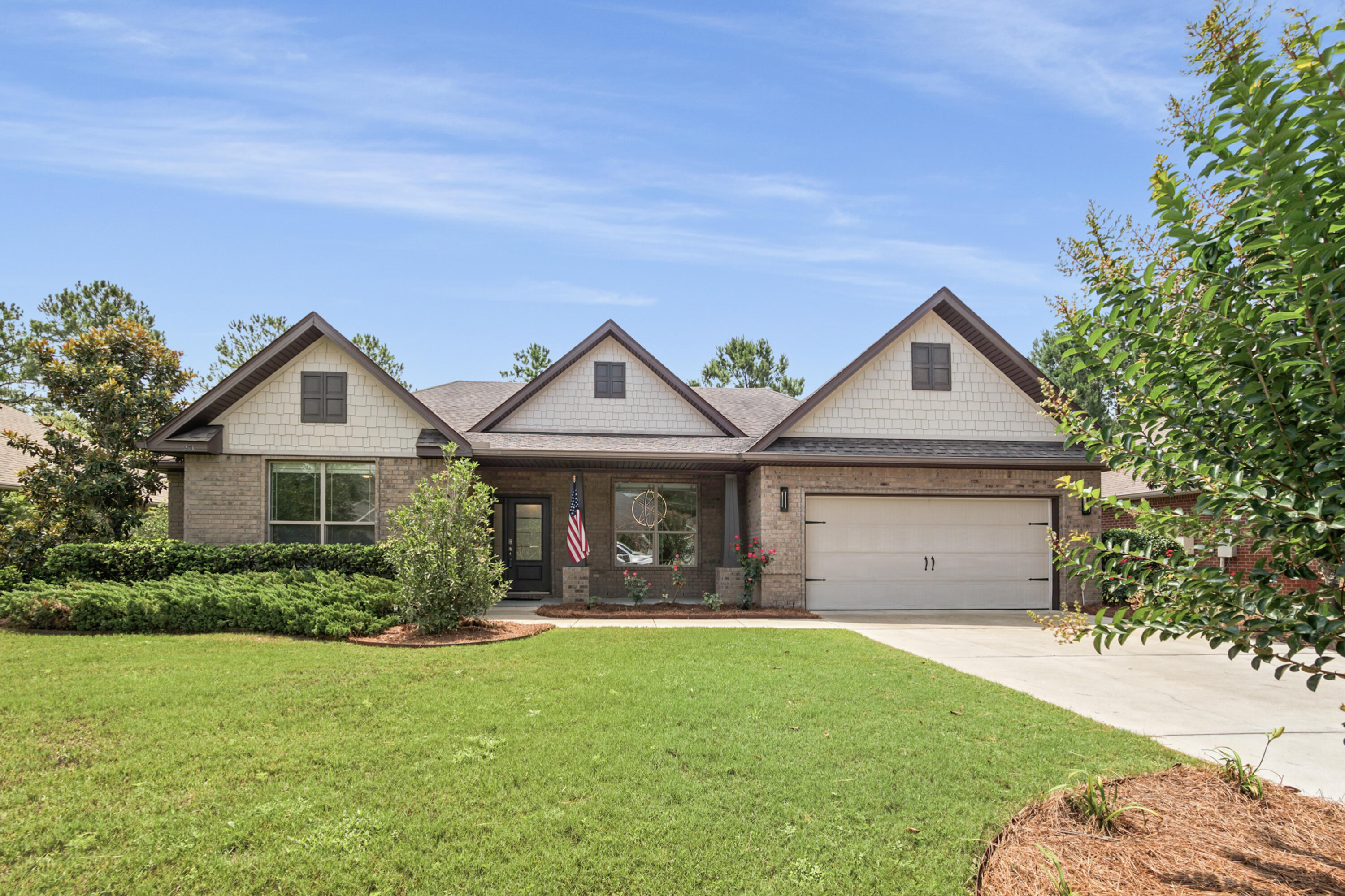 Welcome to 201 Canopy Cove in the highly sought-after community of Hammock Bay in Freeport, FL. This beautifully maintained 5-bedroom, 3-bathroom home offers approximately 2,667 square feet of thoughtfully designed living space with upgrades throughout, and don't forget about front porch sitting. 

Step inside to discover stunning 24''x48'' Italian-inspired tile flooring that flows through the main living areas, creating a modern and elegant feel. Brand-new carpet has been installed in all bedrooms, providing comfort and warmth where it matters most. The open-concept layout is complemented by stylish contemporary fixtures, a formal dining room perfect for entertaining, and a convenient butler's cabinet that adds both function and sophistication.

The spacious kitchen is a chef's delight, featuring a electric range (with a gas hookup if desired in the future), refrigerator, ample cabinetry, and generous workspace for meal preparation. All appliances convey with the sale, including the refrigerator, upright washer, and dryer, making this home truly move-in ready. The versatile fifth bedroom offers endless possibilities and can easily serve as a home office, flex room, playroom, or guest suite.

Outside, you'll find a beautifully fenced backyard designed for relaxation and gatherings, complete with a fire pit and a charming brick paver covered patio ideal for grilling, outdoor dining, or enjoying Florida's beautiful weather year-round; not to mention it's on .27 acres. Additional features include a two-car garage with epoxy floors, generous storage space, 2022 HVAC system, and a floor plan that perfectly balances everyday living with entertaining. 

Conveniently located near schools, shopping, dining, and the stunning Emerald Coast beaches, this exceptional home combines modern style, comfort, and functionality in one incredible package. 

Hammock Bay is known for its resort style amentities including, dock on the bay, tennis courts, basketball courts, workout facilities, multiple clubhouses, multiple pools, playgrounds, grilling stations, parks, trails, pickleball, and so much more. 

Don't miss your opportunity to make 201 Canopy Cove your next home!