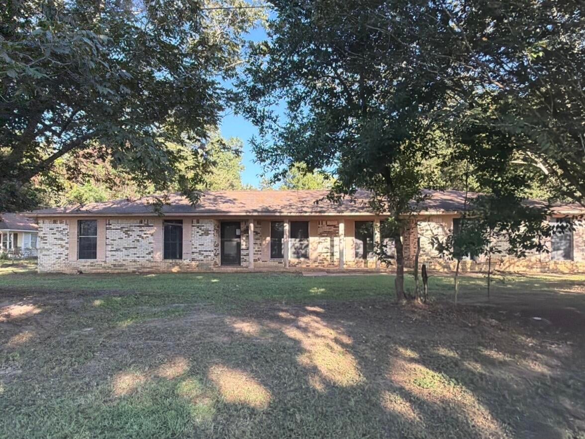 You are absolutely going to want to see this REO opportunity! Resting on right 1.5 acres, this all brick home was built in 1979. The home is mostly fenced and has a side entry 2 car garage. Inside you will find split bedroom design with a single bedroom and 1/2 bath just off the garage, a galley style kitchen leading to a separate dining area and a large, open living room with fireplace. The remaining full bath and 3 bedrooms are together, with the master having a full bath. There is a ton of opportunity with this home and it is certainly a must see to appreciate. The home does need repairs and therefore will not qualify for typical financing, but there are absolutely financing options available. Call today!