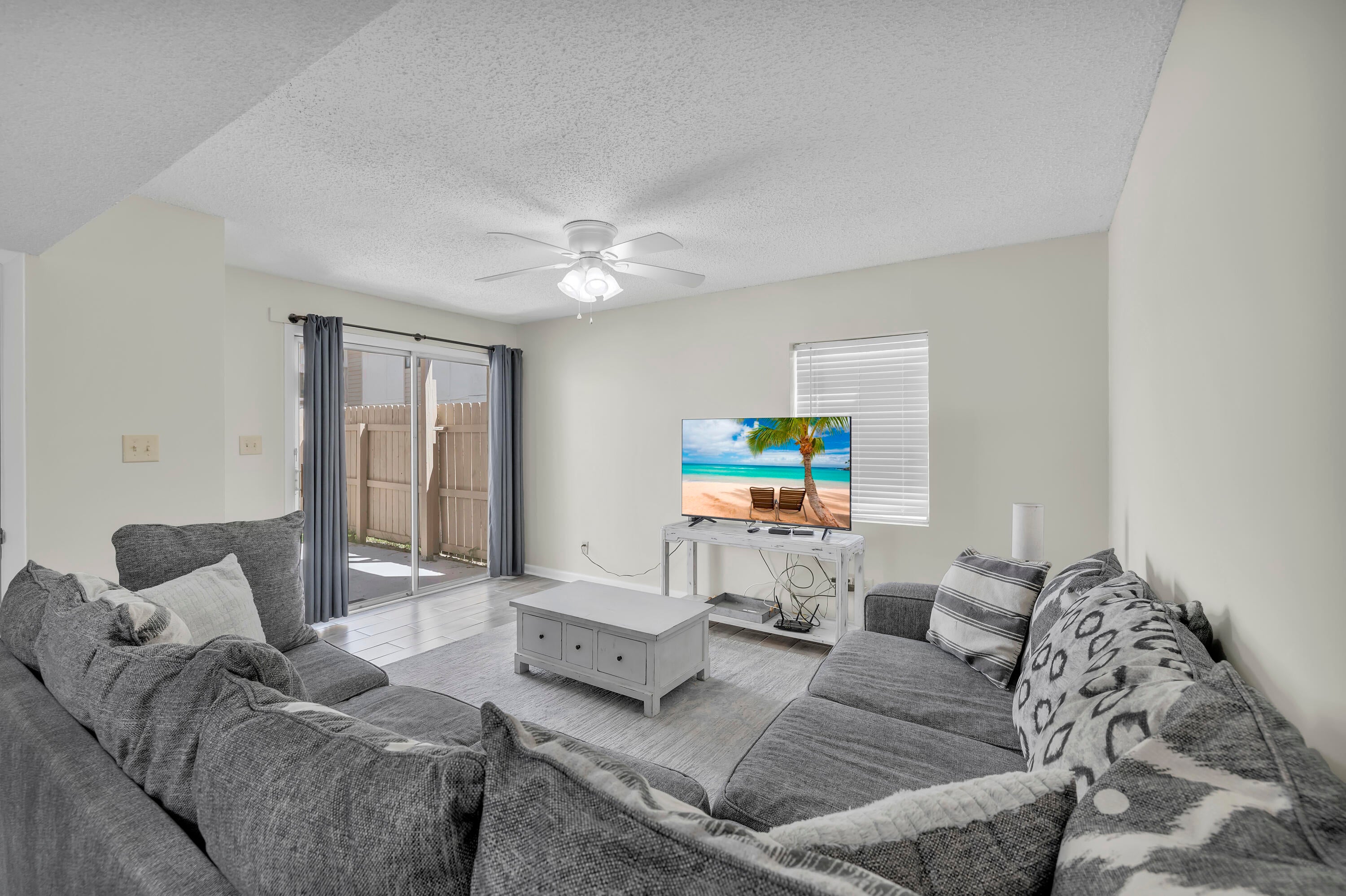 JUST RENOVATED. PRIVATE BALCONIES. COVERED PARKING. Welcome to Horizon South 7A-3, a fully updated 2-bedroom, 2.5-bathroom townhome in one of the most amenity-rich communities on the west end of Panama City Beach. This freshly renovated corner unit includes an assigned covered parking space and is ideally positioned near the community amenities. Inside, you'll find wood-look tile flooring throughout the main level, brand-new carpet upstairs, and updated kitchen and bathroom cabinetry with sleek quartz countertops. The kitchen also features new stainless-steel appliances. Both bedrooms include private en-suite bathrooms and individual balconies, offering a peaceful retreat for guests or family members. The spacious corner balcony provides an expanded outdoor living space with a view toward the amenities area. Horizon South is a gated, golf-cart friendly community located just minutes from Pier Park, Topgolf, the airport, McGuire's Irish Pub, and Dolly Parton's Pirates Voyage Dinner & Show. Community highlights include four pools (one heated seasonally), a kiddie pool, hot tub, tennis and pickleball courts, shuffleboard, mini golf, a game room with billiards, event space, on-site laundry, and more. Owners are welcome to bring pets, and the HOA dues ($636/month) cover water, sewer, internet, trash, grounds maintenance, building insurance, and security. Buyer to verify all information if important.