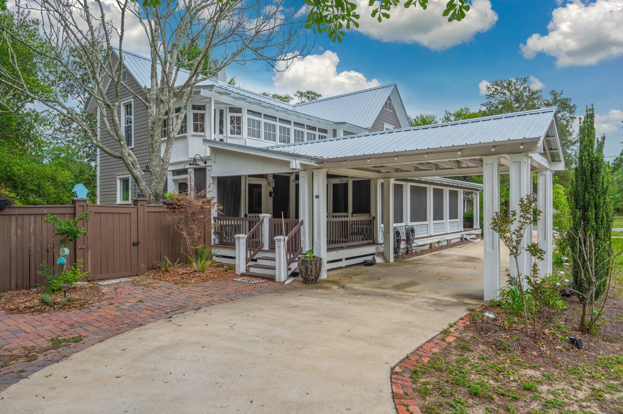 Some homes are built. Others become part of the story of a town. Welcome to 54 Plateau Avenue, a beautiful circa 1900 home in the heart of historic DeFuniak Springs, just one block from Lake DeFuniak and Lake Yard. This is the kind of home that makes you slow down, notice the old trees, pour another cup of coffee and fall in love with small town Southern living.

Inside, gorgeous hardwood floors, crown molding, plantation shutters, built ins, a fireplace and timeless architectural details give this home something you simply cannot recreate. It has character, history and a soul all its own.

And honey, the porches. Morning coffee on the screened porch. Long conversations that last past sunset. Out back, a private deck overlooks the fenced half acre yard, complete with a putting green and room to gather, garden, play or simply breathe.
With the lake and downtown just moments away, you are not simply buying a house. You are stepping into a piece of DeFuniak Springs history and getting the chance to write the next chapter for this address.