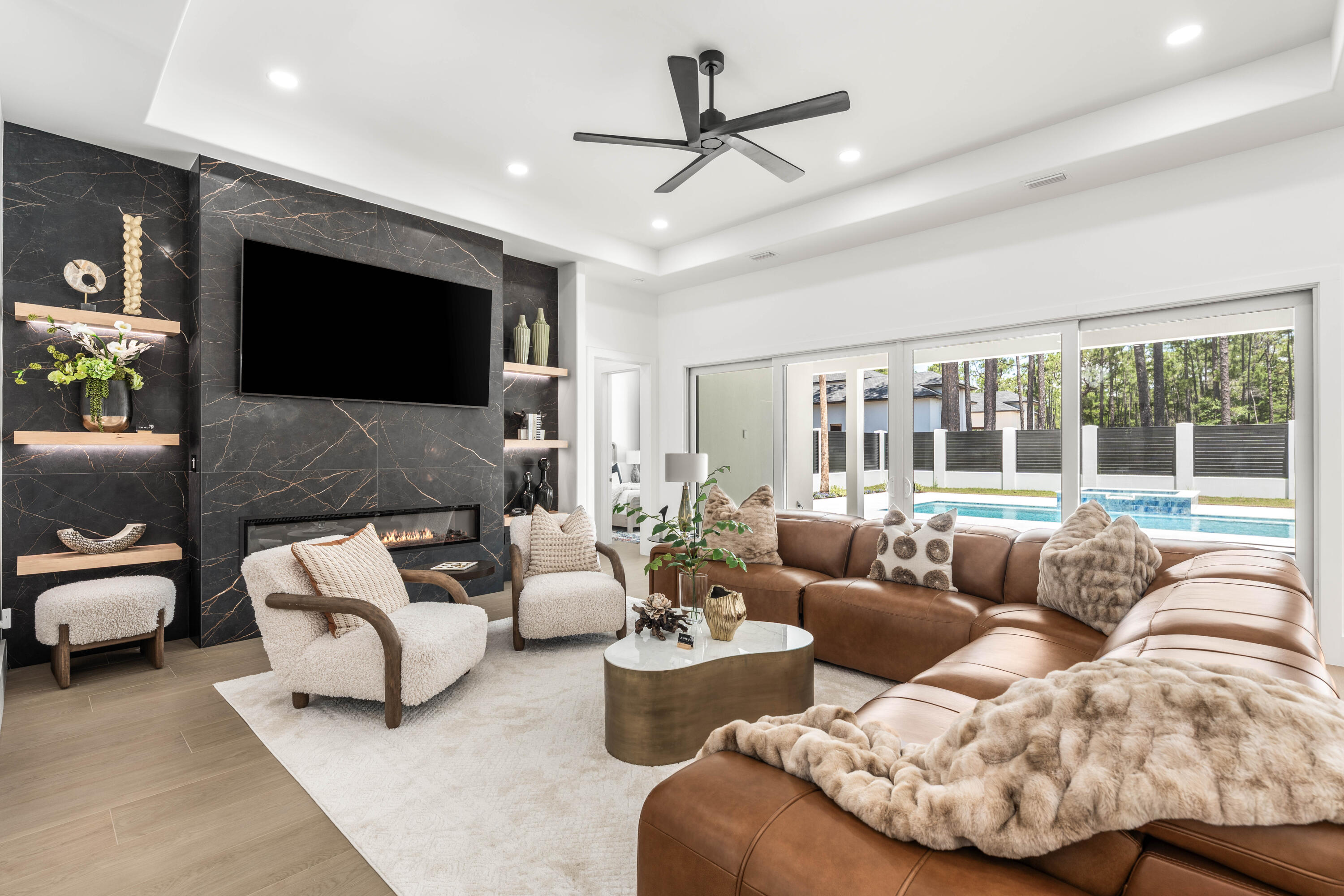 Introducing 1124 Thompson Road! A striking 2026 new construction offering 4,710 heated and cooled Sq/Ft. with a predominantly first-floor layout, refined luxury finishes, and exceptional craftsmanship throughout. Ideally located adjacent to the Santa Rosa Golf & Beach Club. Designed with both sophistication and durability in mind, this exceptional home features hurricane-rated Pella windows and doors, a reinforced concrete safe room, and a hurricane-rated Worthouse metal roof with a warranty up to 200 MPH winds for added peace of mind.

Inside, premium finishes and designer details elevate every space, including luxury tile flooring throughout, custom lighting by Kichler, and a stunning chef's kitchen anchored by a dramatic Cambria quartz waterfall island with matching full-height backsplash. The kitchen is outfitted with a full ZLINE appliance package, highlighted by a 48-inch professional-grade gas range and premium Brizo fixtures.

The open-concept design seamlessly connects to a resort-style outdoor living area on a sprawling 0.39-acre lot, complete with a heated pool and spa, Elementi gas fire pit, and beautifully designed entertaining spaces. Additional features include smart home technology integration, energy-efficient windows and appliances, and a Navien gas tankless water heater.

A rare blend of modern luxury, thoughtful design, and fortified construction, 1124 Thompson Road delivers an elevated lifestyle both inside and out.