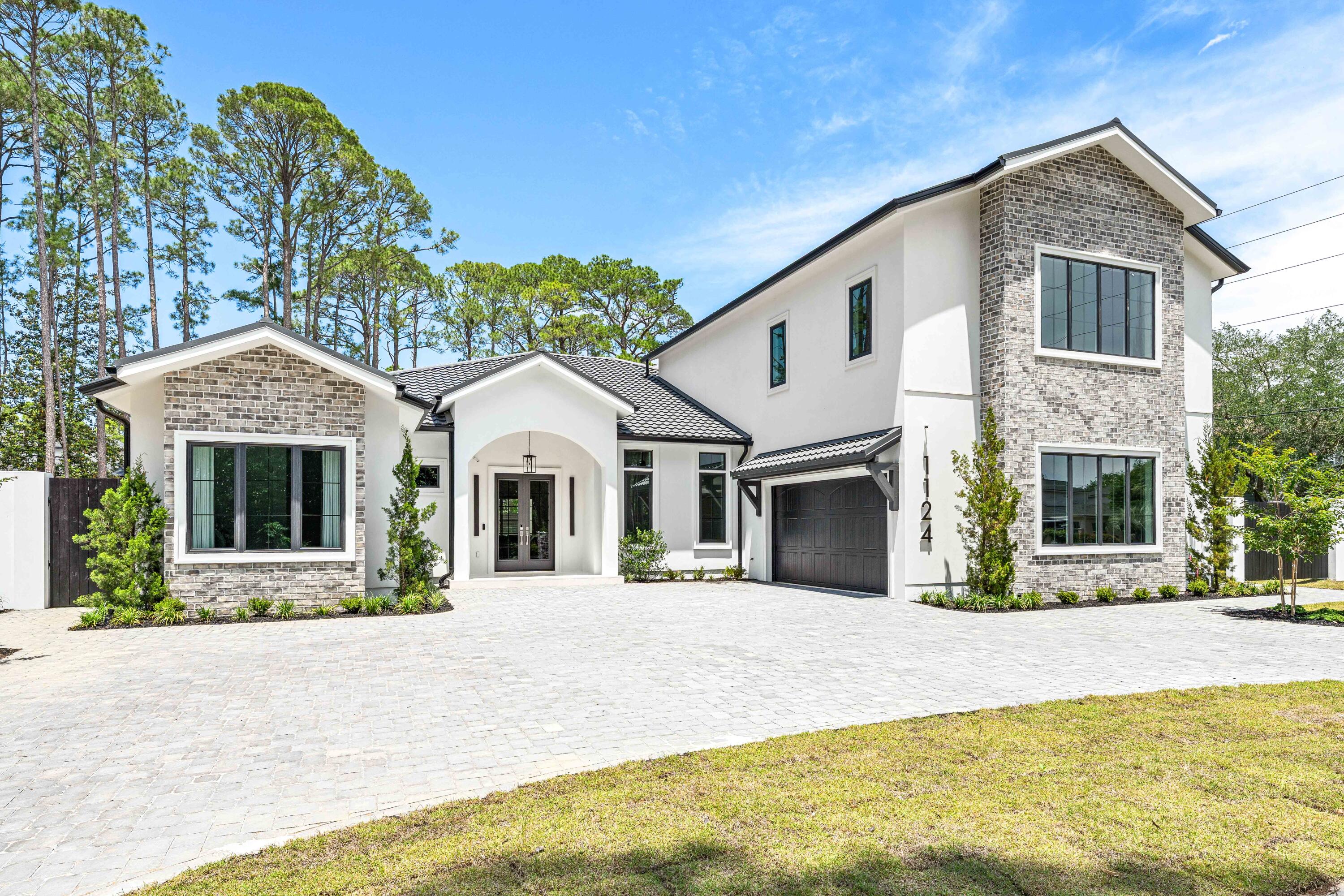 Introducing 1124 Thompson Road! A striking 2026 new construction offering 4,710 heated and cooled Sq/Ft. with a predominantly first-floor layout, refined luxury finishes, and exceptional craftsmanship throughout. Ideally located adjacent to the Santa Rosa Golf & Beach Club. Designed with both sophistication and durability in mind, this exceptional home features hurricane-rated Pella windows and doors, a reinforced concrete safe room, and a hurricane-rated Worthouse metal roof with a warranty up to 200 MPH winds for added peace of mind.

Inside, premium finishes and designer details elevate every space, including luxury tile flooring throughout, custom lighting by Kichler, and a stunning chef's kitchen anchored by a dramatic Cambria quartz waterfall island with matching full-height backsplash. The kitchen is outfitted with a full ZLINE appliance package, highlighted by a 48-inch professional-grade gas range and premium Brizo fixtures.

The open-concept design seamlessly connects to a resort-style outdoor living area on a sprawling 0.39-acre lot, complete with a heated pool and spa, Elementi gas fire pit, and beautifully designed entertaining spaces. Additional features include smart home technology integration, energy-efficient windows and appliances, and a Navien gas tankless water heater.

A rare blend of modern luxury, thoughtful design, and fortified construction, 1124 Thompson Road delivers an elevated lifestyle both inside and out.