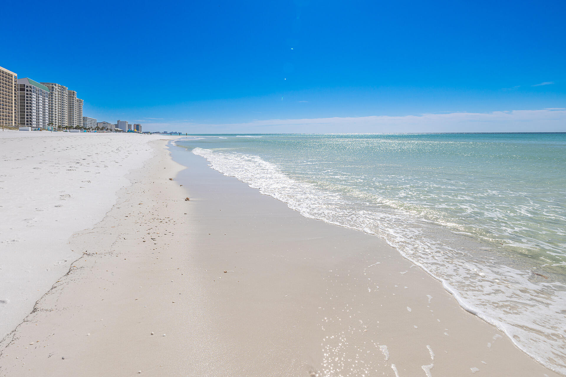 Spacious two bedroom/two bath condo, located on the 2nd floor of the Breakers East building directly on the beach.  Extensive beachfront views from the spacious 30 ft balcony with access from the master bedroom and living room. Relax on your private balcony with beautiful beachfront views. Master bedroom/ master bathroom remodeled with Jacuzzi tub, separate walk-in shower, & double vanity. All tile floors.