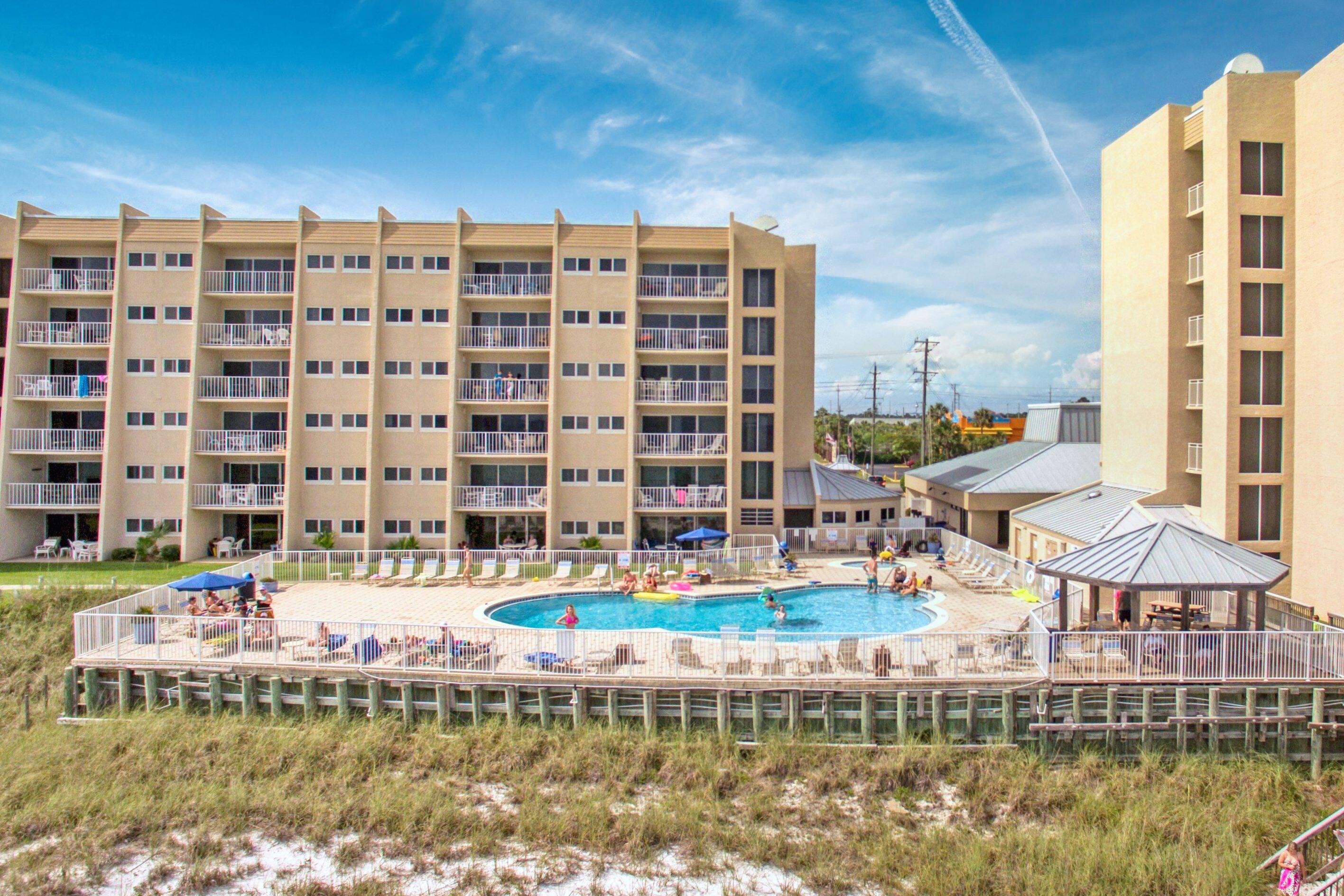 This fabulous direct beach front condo has been recently remodeled and has a panoramic view of the Gulf.  Granite counters and stainless appliances in the kitchen. LVP flooring throughout the whole condo.  Gorgeous walk in glass and tile shower with granite vanity in one bathroom and a shower tub in the 2nd bathroom.  Beach House is a low rise community closer to the beach than most other condos in the area and has some of the least crowded beaches around thanks to approximately 600' of private beach. Located on the popular walking/bike path on Scenic 98. Many fun restaurants and attractions in the area. Top of the line amenities include access to the beach , fitness center, tennis, shuffle board, gulf front pool and hot tub. Plenty of room for the family to make memories and you can also cash in $$$ on short term rentals.