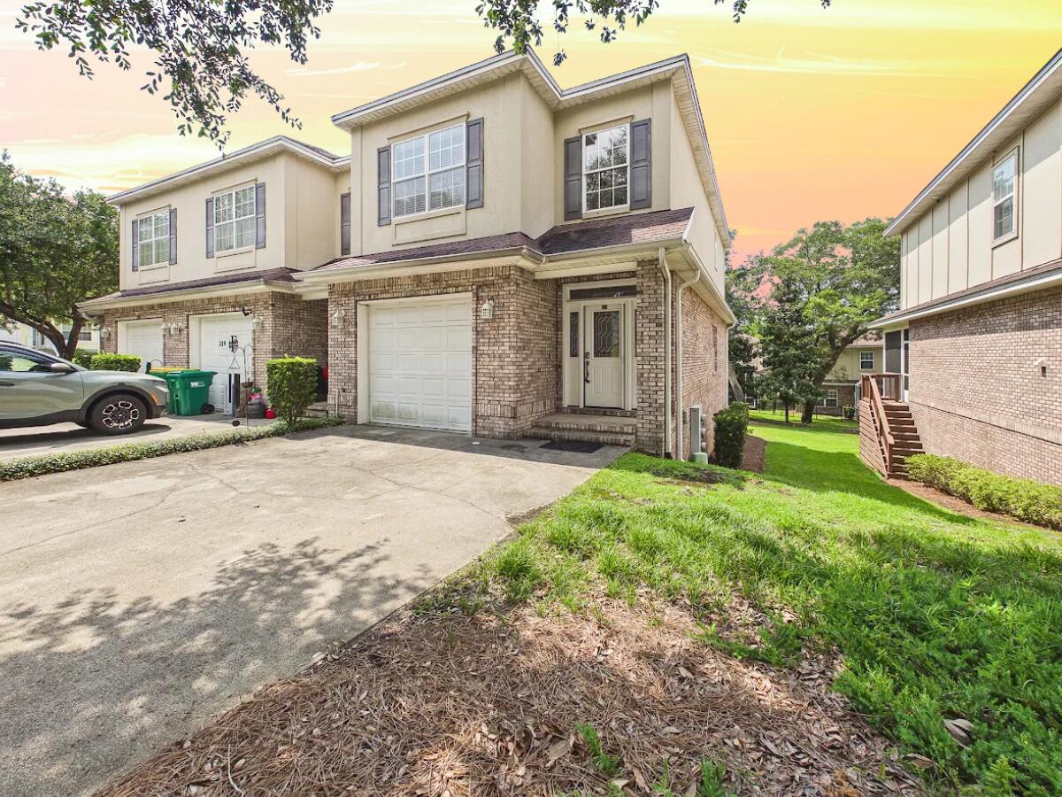 Beautiful END UNIT townhome in the heart of Niceville, zoned for top-rated Niceville schools and located just minutes from area military bases & NWFL State College! Freshly updated with new interior paint (July 2026), this well-kept home features a light-filled open layout centered around an electric fireplace, with ceiling fans throughout for year-round comfort. The fully equipped kitchen boasts solid surface countertops, an extra-long breakfast bar, stainless steel appliances, and a large pantry. Tile runs through the foyer, half bath, and wet areas, complemented by crown molding throughout. Upstairs, find all bedrooms, including a spacious primary suite featuring dual vanities, a garden/whirlpool tub, a separate shower, and a private, enclosed toilet room. Enjoy added conveniences like 2nd-floor laundry hookups, lighted under-stair storage, and a 1-car garage. Major system updates include an HVAC replacement in 2015 and a water heater replacement in 2006. Best of all, the HOA handles lawn care, common area maintenance, and exterior upkeep (including the roof), making this low-maintenance property ideal for a personal residence or turnkey investment!