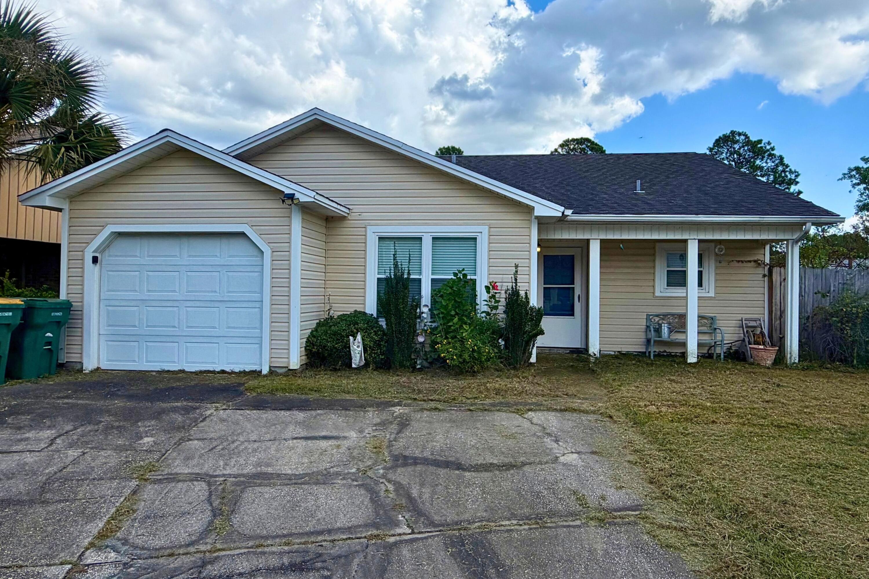 Home located in the Hidden Trails community of Fort Walton Beach on a large corner lot. The property features an open floor plan, tile flooring, granite countertops, wood beams, and a spacious driveway. The home needs some TLC and updating but offers plenty of potential. The large lot provides additional outdoor space and room for a buyer to make improvements and add their own personal touches.