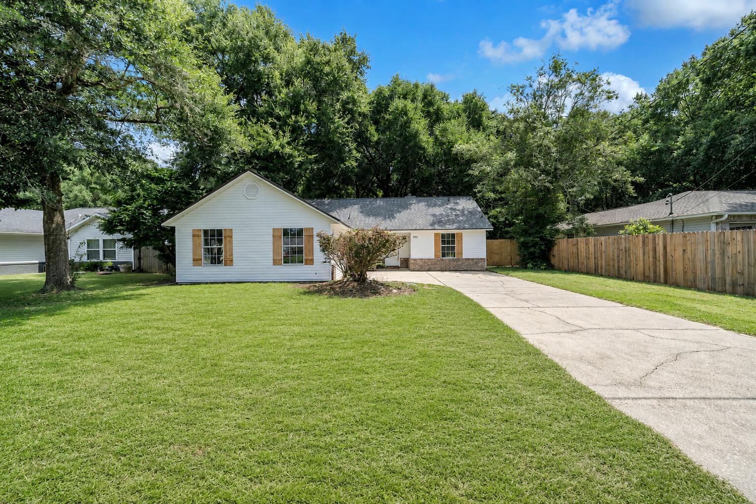 Better than new and beautifully renovated, this inviting home in the desirable Kings Crossing subdivision offers the perfect blend of modern comfort, thoughtful updates, and spaces designed for both everyday living and entertaining. Tucked away south of I-10, this move-in-ready 3-bedroom, 2-bath home with a spacious bonus room provides room to spread out while offering a peaceful retreat from the hustle and bustle.

From the moment you enter, you'll appreciate the attention to detail and extensive updates throughout. The thoughtfully designed split-bedroom floor plan centers around a spacious great room featuring a newly refinished wood-burning fireplace with gas starter, creating a warm and inviting gathering space. French doors open to the large backyard and newly refinished patio, making indoor-outdoor living and entertaining effortless. The versatile bonus room provides endless possibilities and could easily serve as a fourth bedroom, home office, second living area, playroom, or hobby space.

The beautifully updated kitchen is filled with natural light and features new wood cabinetry, custom quartz countertops, a modern subway tile backsplash, and brand-new stainless steel appliances. With plenty of room for a work island, a separate dining area, and an open connection to the great room, this is a kitchen designed to be both functional and welcoming. The private primary suite offers a relaxing retreat with a separate dressing area, single vanity, walk-in closet, and completely updated ensuite bathroom featuring a new tub, toilet, and modern finishes.
No detail has been overlooked, with luxury vinyl plank flooring throughout, new exterior doors, fresh paint, updated finishes and fixtures, a brand-new roof (2026), new HVAC (2026), and new water heater (2026).

Step outside and discover what truly sets this property apart. The fully fenced backyard provides plenty of space to relax, garden, entertain, or simply enjoy your own private outdoor retreat. The newly refinished patio is ready for morning coffee, evening gatherings, and everything in between. For the hobbyist or craftsman, the property features two outdoor storage buildings, including a powered workshop with electrical hookup--a woodworker's dream and an incredible space for hobbies, projects, tools, or additional workspace. A second storage shed provides even more room for storage.

Beautifully renovated, exceptionally functional, and filled with spaces to create, gather, and unwind, this is more than a move-in-ready home--it's a place to create a life away from the ordinary.
