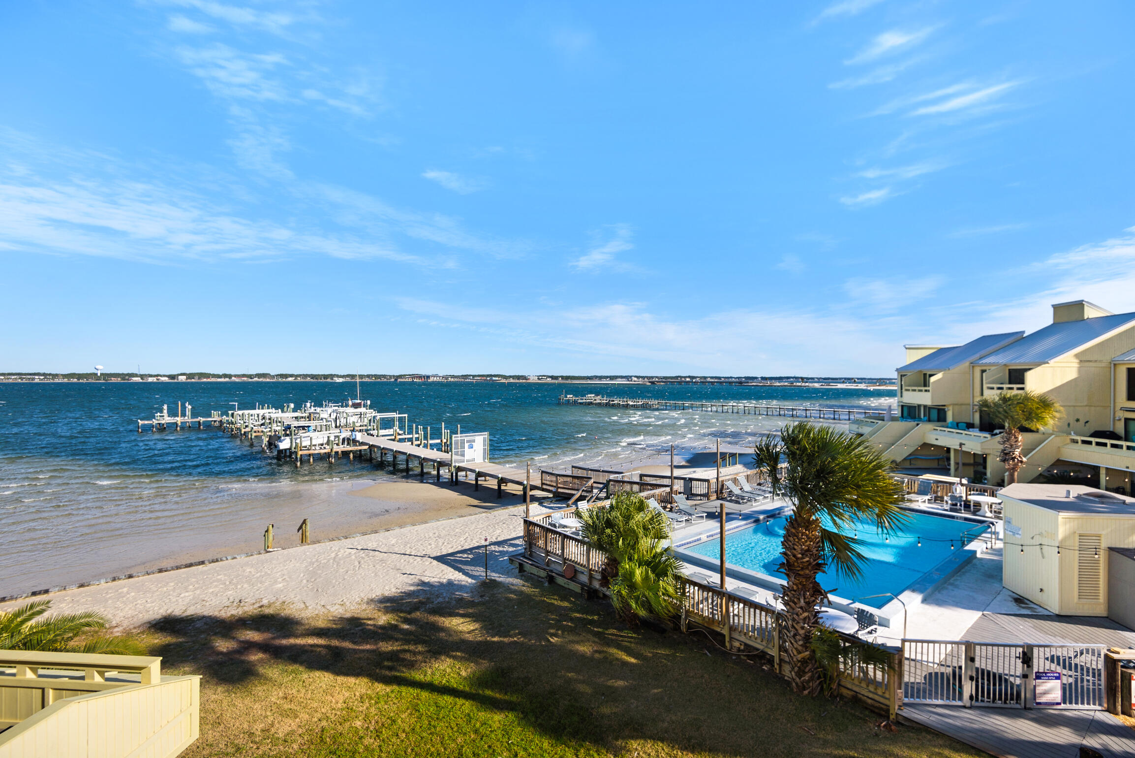 AGGRESSIVELY PRICED! Rare 4-Bedroom Bayfront Townhome with Private Boat Slip & Lift--One of the Best Values from Pensacola Beach to Navarre!

Sold fully furnished, Buena Vida 23 offers 2,467 sq. ft., 4 bedrooms, 3 baths, and one of the community's most desirable floor plans with the rare fourth bedroom and third full bath. Enjoy panoramic Santa Rosa Sound views, your private boat slip with lift, and the Navarre Beach public boat ramp less than five minutes away. Fish, boat, paddleboard, or watch dolphins from your balcony.

The open, light-filled floor plan, oversized garage, two HVAC systems, bayfront pool, tennis courts, and easy walk to Navarre Beach and the fishing pier make this an exceptional primary home, vacation getaway, or investment property. Currently operating as a successful vacation rental with excellent income potential.

Currently operating as a successful vacation rental, this property offers excellent income-producing potential for investors or the perfect opportunity for a second home getaway.

Don't miss one of the best opportunities to own a bayfront townhome with a boat slip and lift on the Emerald Coast. Schedule your private showing today Natural light pours throughout the spacious multi-level floorplan, creating a bright and airy atmosphere that perfectly complements the tranquil bayfront setting. This is one of the few units in the complex featuring the highly desirable fourth bedroom and third full bathroom addition, making it ideal for large families, guests, or maximizing vacation rental income potential.

Relax poolside while overlooking the sparkling waters of the bay, enjoy a match on the tennis courts, or take a short stroll to the sugar-white sands of Navarre Beach and the iconic Navarre Beach Pier. The oversized garage provides ample storage for beach gear, fishing equipment, and personal belongings.

Currently operating as a successful vacation rental, this property offers excellent income-producing potential for investors or the perfect opportunity for a second home getaway. Additional features include two AC units for maximum comfort and energy efficiency, with the west building location helping keep utility costs lower year-round.

Whether you are searching for a primary residence, vacation retreat, or high-performing investment property, this exceptional bayfront gem truly checks every box. Don't miss your opportunity to own one of Navarre Beach's most unique and desirable properties to bring your boat!