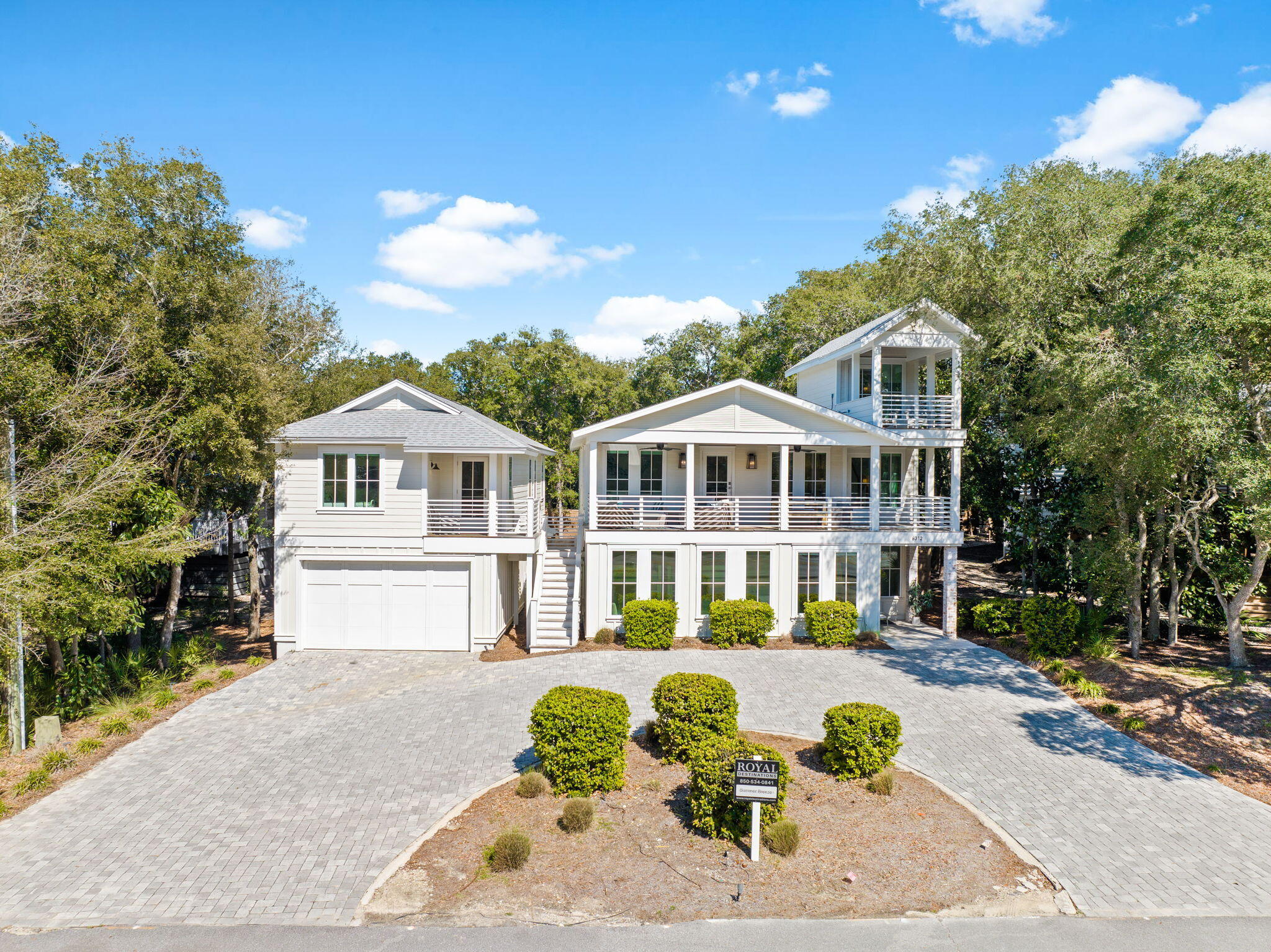 This freshly reimagined coastal escape delivers elevated 30A living without cutting a single corner. The property features a heated resort-style pool and a newly built oversized garage topped with an adorable carriage house that absolutely pulls its own weight.

Just a quick stroll from the sugar-white sand and emerald Gulf waters, the main home offers seven bedrooms and seven bathrooms and comfortably sleeps up to 22 guests. Translation: room for everyone and then some. Inside, the open-concept living space was designed to impress without trying too hard. A chef's kitchen anchors the home with stainless appliances, a generous island, and exposed brick details that flow effortlessly into the dining and living areas. Rich wood floors, custom trim, shiplap accents, marble tile, and designer finishes deliver that polished coastal look buyers crave.

Indoor and outdoor living blend seamlessly here. Spend mornings on the porch, afternoons poolside, and evenings enjoying the lush backyard oasis. The carriage house adds even more flexibility with a full kitchen, living space, bedroom, bathroom, and a covered patio overlooking the pool. Ideal for guests, in-laws, or anyone who believes vacation days should last forever.

And the location. This is where it really shines. You're close to Gulf Place for shopping, coffee, live music, and easy dinner plans plus beach access is within a five-minute walk at Beach Highlands, with Bullard Beach access nearby and a scenic stroll down to Dune Allen Beach access when you feel like mixing it up. Stinky's Fish Camp is close for sunset dinners, and a run to 3 Sons BBQ is practically a local rite of passage. Beach walks, fresh seafood, and laid-back coastal living are all right outside your door. This one checks every box and then casually adds a few more.
