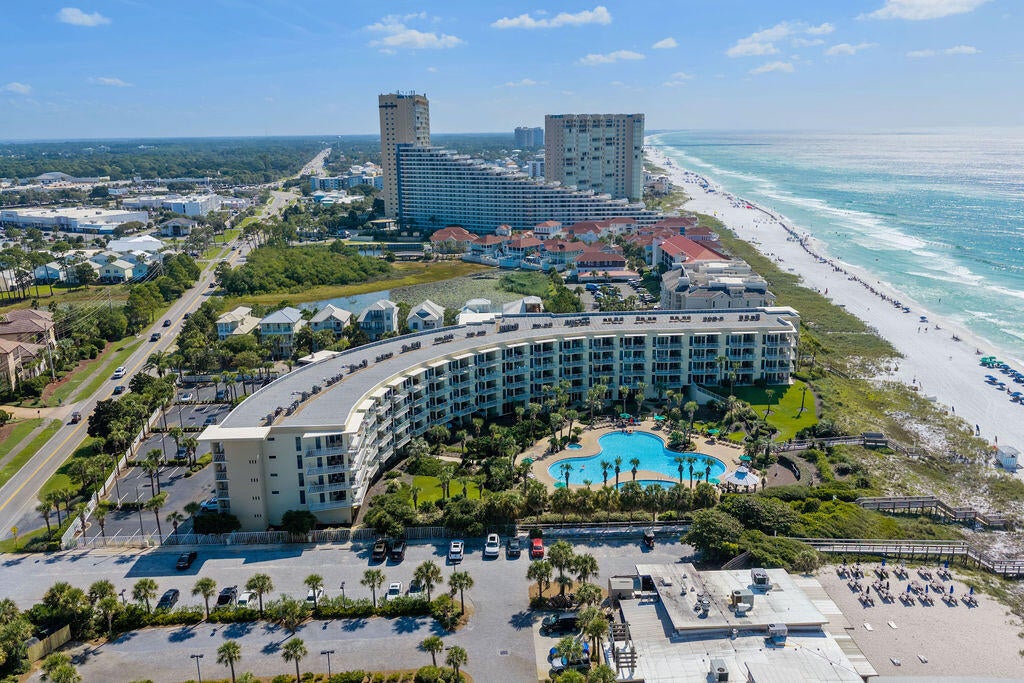 GULF FRONT LIVING & RESORT-STYLE AMENITIES IN THE CRESCENT

Beautifully positioned in the coveted Crescent, this inviting Gulf front condo offers a comfortable coastal retreat with an ideal combination of direct Gulf frontage, spacious living, and resort-style amenities. The large living area opens to a private porch overlooking the Gulf, creating the perfect setting to enjoy the coastal views and beautiful surroundings.

The generous primary suite features Gulf views and a spacious private bathroom. A separate bunk room with twin-over-queen bunks provides additional sleeping space, complemented by a second full bathroom.

Residents enjoy an impressive array of Crescent amenities, including two community pools--one heated seasonally--a hot tub, fitness center, conference room, office space, covered parking, and a gated entrance. The unit also includes a private storage locker, providing convenient space for beach gear and personal belongings. With its Gulf front location, proven rental history, fully furnished and turn-key ready, and exceptional amenities, this condo offers an appealing opportunity for a beach getaway, second home, or investment property.
All information is believed to be accurate but should be verified.