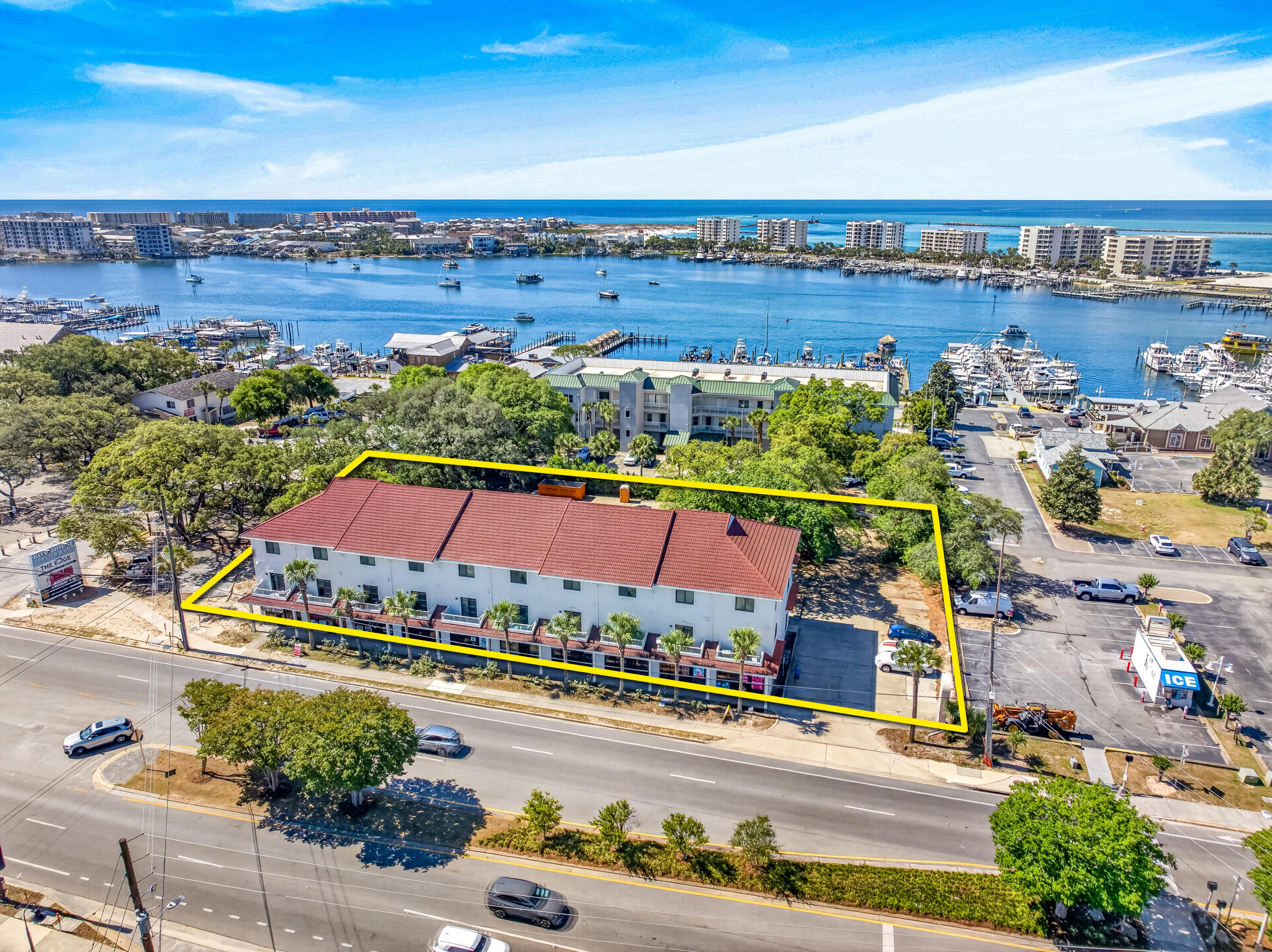 This entire building is offered for sale, which is located on the South side of Harbor Boulevard in Destin, Florida, encompassing (10) contiguous commercial retail storefront units, each measuring +/-600 SF, in addition to (10) two-story apartments, each measuring +/-1,400 SF with 2 bedrooms and 2.5 baths, featuring front and rear balconies.  The strategic location of the site creates exceptional synergy from patrons walking across Harbor Boulevard from one of the City of Destin's largest public parking lots, which is located on the North side of Harbor Boulevard with a pedestrian crossing directing... visitors to the retail storefronts of this subject venue, known as Harbor Village.   The entire building has been renovated. The site contains nearly 1-acre, approximately 220' of Highway 98 (aka, Harbor...Boulevard) frontage, and a total of (56) parking spaces.  Each of the (10) separate deeds include (1) commercial retail storefront and (1) residential apartment atop the commercial space, both offering independent access, thus allowing for two different tenants in each of the units; in other words, the building in entirety could host (20) different tenants.  The City of Destin zoning is known as South Harbor Mixed Use (SHMU).  Please refer to the zoning fact sheet that is uploaded to this listing. Please inquire for further information and to coordinate a private showing.