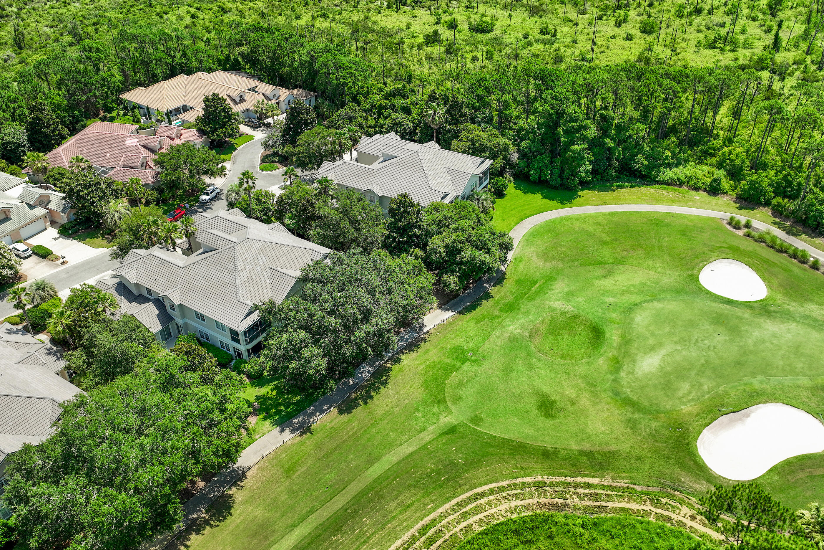 Located in the highly sought-after gated community of Regatta Bay, this beautiful first-floor Golf Villa offers 3 bedrooms, 3 full baths, 2,195 sq. ft. and a 2-car garage with stunning golf course views. The spacious floor plan features an abundance of natural light and seamless indoor-outdoor living with a large screened-in patio wired for a TV--perfect for relaxing or entertaining while enjoying the tranquil fairway setting. This move-in-ready residence has been extensively upgraded with a new roof, gutters, interior and exterior paint, tankless water heater, flooring, windows in the living room, smoke detectors, toilets, faucets, vents, hardware, light fixtures, ceiling fans and window treatments. The kitchen has been refreshed with new LG stainless appliances, added pantry shelving and a custom spice rack on the pantry door. The laundry room features a new sink along with a new washer and dryer. Thoughtful storage solutions have been added throughout, including custom shelving in all bedroom closets, the pantry, coat closet and storage areas, along with new garage storage systems. Every detail has been carefully considered, creating a home that combines style, functionality and low-maintenance living. Enjoy the exceptional lifestyle Regatta Bay is known for, with beautifully maintained grounds, premier golf and a central Destin location close to shopping, dining, entertainment and the Emerald Coast's world-famous beaches.