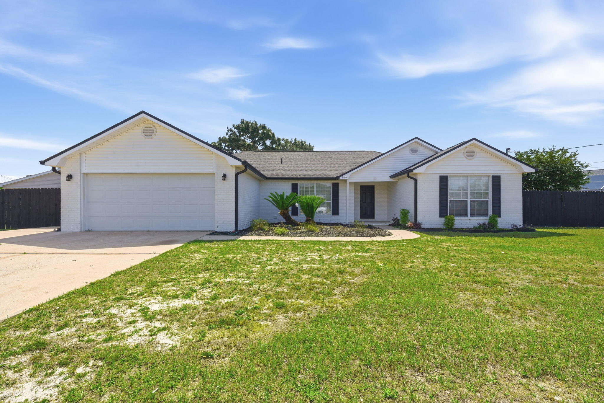 Welcome home! Perfect location in East Navarre, just minutes to the white sandy beaches of the Emerald Coast. Located in Hampton Ridge Estates with NO HOA! Home was completely renovated in 2023, 3 year old roof and HVAC, 5 year old hot water heater, all new lighting fixtures and ceiling fans. This split floor plan offers optimal space with modernized style. The kitchen features solid quartz countertops, tile backsplash, a full dinning, breakfast bar and nook. Vinyl plank flooring throughout the home. Master bedroom is spacious with double vanity sinks, walk-in shower and closet. The washer and dryer in laundry room convey with home as well as electric car charging station in garage. This corner lot features an extended drive way and side yard with a playground! Schedule your showing today!
