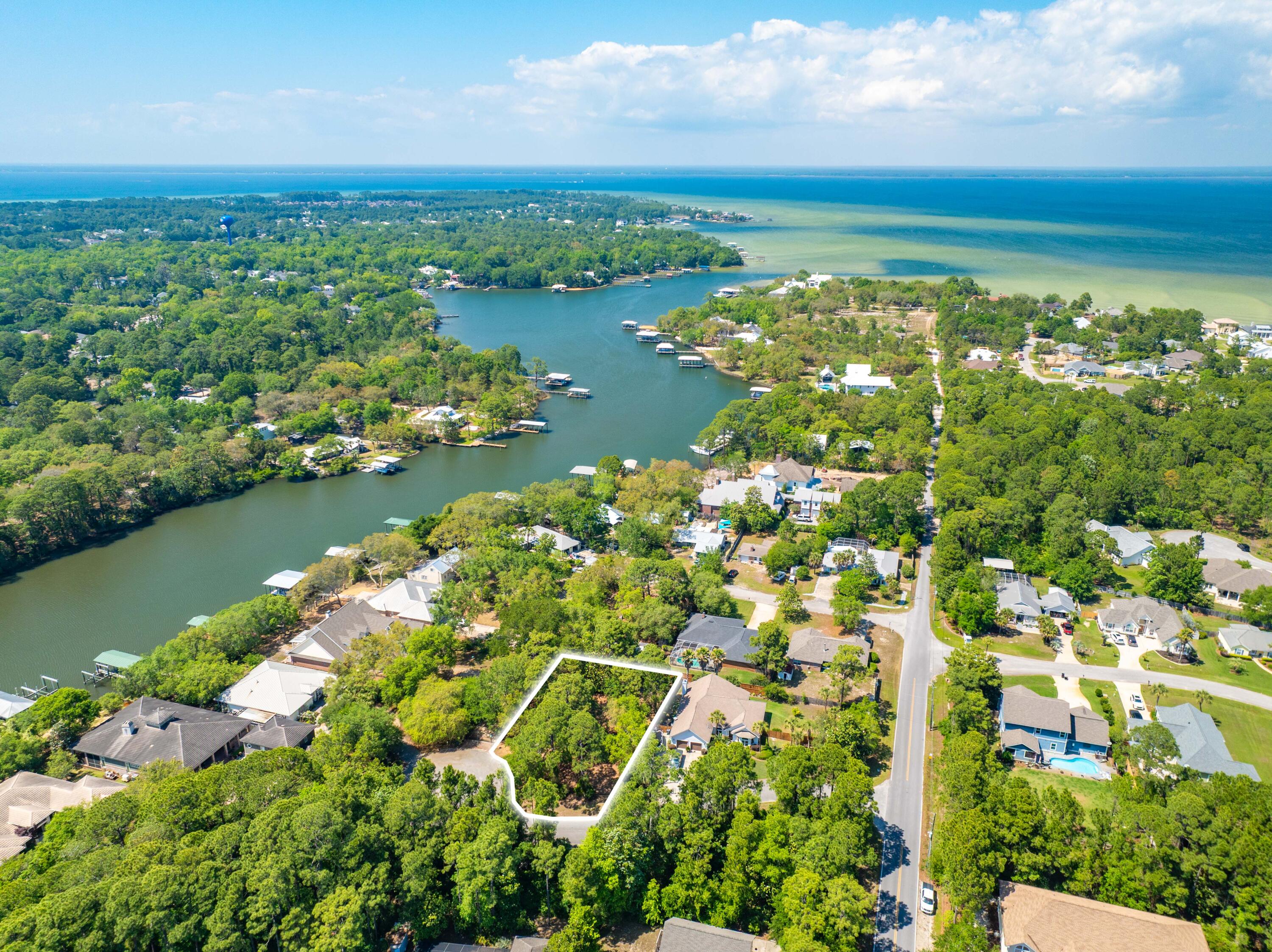 Rare opportunity to purchase a large vacant lot for sale in Santa Rosa Beach, Florida -- one of the most desirable communities along the renowned 30A corridor on Florida's Emerald Coast. Situated at 50 Windy Way within an established community of Bayou Breeze, this exceptional residential building site offers the location, scale, and lifestyle amenities discerning buyers demand. Whether you are seeking a custom home site for a primary residence or a vacation retreat in Santa Rosa Beach. Positioned just minutes from the iconic 30A Scenic Highway, this Santa Rosa Beach lot offers effortless access to the Gulf Coast's most celebrated beach communities -- including Seaside, Rosemary Beach, WaterColor, and Grayton Beach. World-renowned sugar-white sand beaches and emerald Gulf waters are within Positioned just minutes from the iconic 30A Scenic Highway, this Santa Rosa Beach lot offers effortless access to the Gulf Coast's most celebrated beach communities -- including Seaside, Rosemary Beach, WaterColor, and Grayton Beach. World-renowned sugar-white sand beaches and emerald Gulf waters are within a short drive, placing the very best of Emerald Coast living at your doorstep.
Vacant lots of this size, quality, and location are a finite commodity in Santa Rosa Beach and the broader South Walton real estate market. With continued demand for custom home sites along the 30A corridor, proximity to the bay, top-tier healthcare, and the unmatched retail and dining of Grand Boulevard, 50 Windy Way offers a rare convergence of lifestyle, convenience, and value.