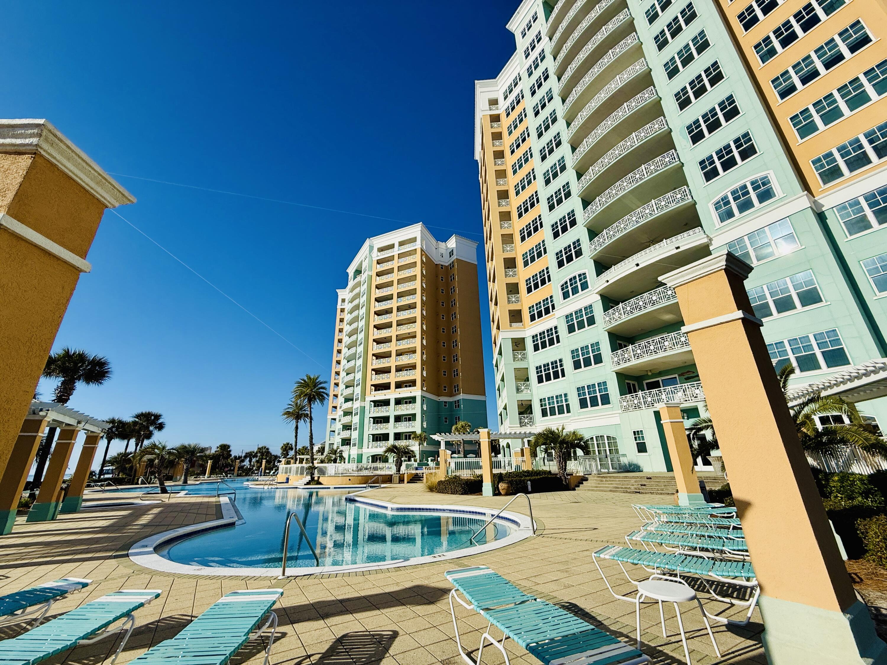 NEW PRICE! GULF-FRONT PENTHOUSE + EXPANSIVE TERRACE WITH PRIVATE POOL!
Welcome to 7505 Thomas Dr, PH 121G, a first-floor penthouse at En Soleil in South of Grand Lagoon on Panama City Beach, offering panoramic Gulf views, 5 bedrooms, 4 en-suite baths, and 3,079 sq ft. Fully furnished, this residence features a 1,700 sq ft private terrace ideal for indoor/outdoor living, with a 16x10 heated pool and outdoor kitchen. The split floor plan provides privacy, while floor-to-ceiling windows fill the space with natural light. Includes deeded garage parking space and a deeded storage room. Strong rental potential with projections up to $150,000 annually and resort-style amenities make this a standout investment or second home, offering a total of 4,779 sq ft of coastal living along the Emerald Coast! Enjoy expansive Emerald Coast views from the oversized private terrace--perfect for morning coffee or sunset evenings. The newly resurfaced heated pool anchors the outdoor living space, complemented by an outdoor kitchen with grill and partially covered lounge and dining areas designed for year-round entertaining and relaxation.

Recent upgrades include Cat-5 hurricane-rated windows and sliding glass doors (2023), two new HVAC systems (2024), updated baseboards and crown molding, new blinds throughout, exterior patio tile border, freshly painted terrace privacy fence, upgraded pendant lighting, a new gas fireplace, seven new smart TVs, and an additional refrigerator in the private storage room located just outside the front door.

Inside, the open-concept kitchen features an eat-in bar, new refrigerator, wine refrigerator, custom cabinetry, granite countertops, and two dining areas, creating an ideal flow for gatherings. The open layout seamlessly connects the living, dining, and kitchen spaces, supporting both everyday comfort and entertaining.

En Soleil features two 15-story towers with only 88 total units and just 2-3 residences per floor, offering a quiet and private setting. This gated community includes 24/7 security, private beach access with seasonal chair service, two beachfront hot tubs, resort-style pools, a fitness center, conference room, and underground garage parking. This unit includes a deeded garage parking space with elevator access.

Conveniently located near world-class golf, sport fishing, fine dining, and boutique shopping, En Soleil offers over 6,500 square feet of swimming pools, waterfall features, and 450 feet of private sugar-sand beach. From the pool deck, follow the private walkway directly to the Gulf!

Don't miss this rare opportunity to own a penthouse along The Emerald Coast - Schedule your private showing today!
