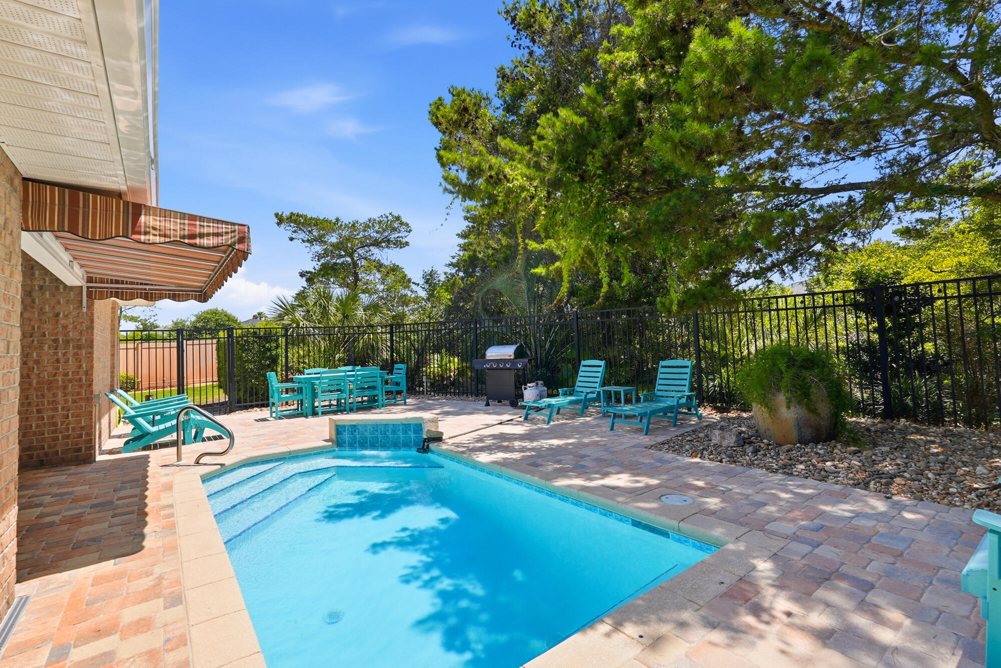 Fully furnished, fully renovated, & rental-ready, this stunning 4-bedroom + bunk room, 3-bath home with a private pool is in the highly sought-after beachside community of Paradise Retreat. Paradise Retreat features both north and south gate entrances and 320 feet of private deeded beach access. One of the community's most desirable split-bedroom floor plans, this home is ideal as a primary residence, second home, long-term rental, or high-performing vacation rental with projected annual gross rental income of approximately $85,000. Inside, the spacious layout with tile plank flooring throughout, includes a large kitchen, breakfast nook, dining area and an open great room that flows  to the covered patio and pool area. The primary suite overlooks the backyard and features a private ensuite bath. On the opposite side of the home, you'll find three guest bedrooms, a bunk room, and two additional full baths, plenty of space for family and guests. The outdoor living area is designed for relaxation and entertaining, complete w/ paver stones, polywood lounge chairs, tables, fully fenced and an additional separately fenced side yard perfect for pets or game area. The home also backs up to a wooded preserve for added privacy and is one of only 16 homes in the circle with an oversized backyard.
Brand-new driveway pavers, brand new extended backyard pavers, brand-new HVAC system being installed June 11th, and a brand-new roof to be installed prior to closing.