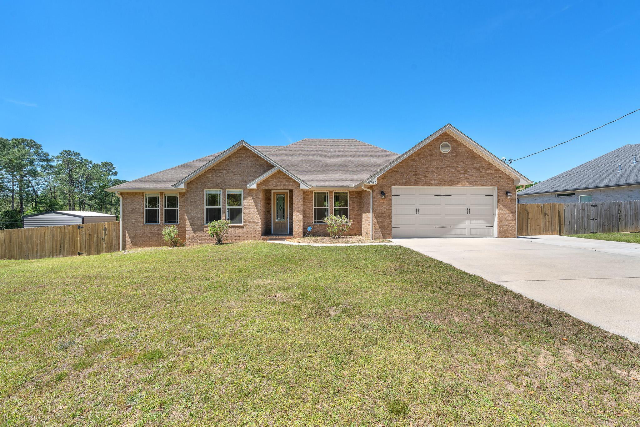 Florida living at its finest! Welcome to this beautifully upgraded 4-bedroom, 2.5-bathroom home located in Crestview, FL. Designed with comfort and style in mind, this spacious home features quality finishes and thoughtful details throughout.

The kitchen is a true centerpiece, showcasing granite countertops, stainless steel appliances, and a gas range perfect for cooking and entertaining. Premium shutters, elegant tray ceilings, and modern upgrades add a touch of sophistication throughout the home.

The oversized 20' x 30' garage provides plenty of room for parking, storage, or hobbies. The spacious primary suite offers a relaxing retreat with a luxurious garden tub, while the large screened porch and back deck create the perfect outdoor spaces to enjoy the beautiful Florida weather.

With a generous floor plan, stylish finishes, and inviting indoor and outdoor living spaces, this home offers the perfect blend of functionality and elegance. Don't miss the opportunity to make this Crestview gem your new home! Contact us today for a showing!