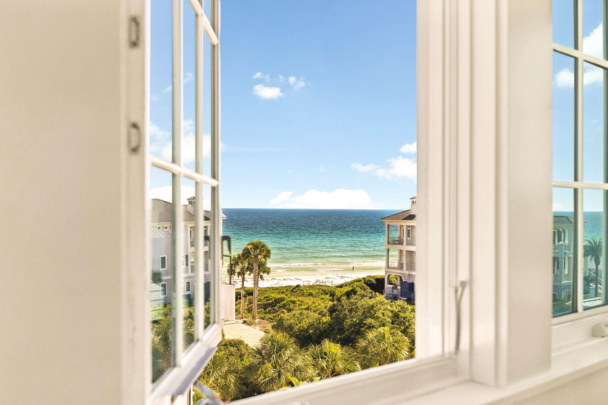 Set within Heritage Dunes, one of Seagrove Beach's most coveted gated, non-rental communities south of Scenic Highway 30A, this newly constructed residence offers something increasingly difficult to find along the coast...Privacy, Gulf views, deeded beach access, and the ease of a distinctly residential setting just moments from the best of 30A.
Spanning 4,244 square feet, the home reflects a thoughtful approach to coastal architecture, with detailed trim work, custom cabinetry, warm woodwork, and an intentional use of windows to draw natural light and Gulf views throughout the interiors. The design keeps the coast present from room to room.
The kitchen is a defining feature of the home. A substantial island anchors the space, surrounded by thoughtfully integrated cabinetry and a distinctive run of windows beneath the upper cabinets allowing the Gulf to remain in view while cooking, gathering, or entertaining. The adjoining living spaces are open without sacrificing character, complemented by gas fireplaces and generous balconies that extend everyday living outdoors.
Five well-proportioned bedrooms and five full baths provide comfortable separation for family and guests, while an elevator connects each level with ease. Above, a private lookout tower offers a quiet retreat of its own, equally suited to morning coffee overlooking the coast or a glass of wine as the evening settles over. Surrounded by the natural beauty of the coast and just steps from the emerald waters of the Gulf, Heritage Dunes offers a level of privacy that feels increasingly rare along 30A. The gated, non-rental setting preserves a quieter residential atmosphere, creating a sense of retreat without sacrificing proximity to the places that make this stretch of the coast so sought after.
For the buyer seeking more than proximity to the beach, this is a distinctive opportunity: New construction, Gulf views, deeded beach access, and the privacy of a gated, non-rental enclave all south of 30A.