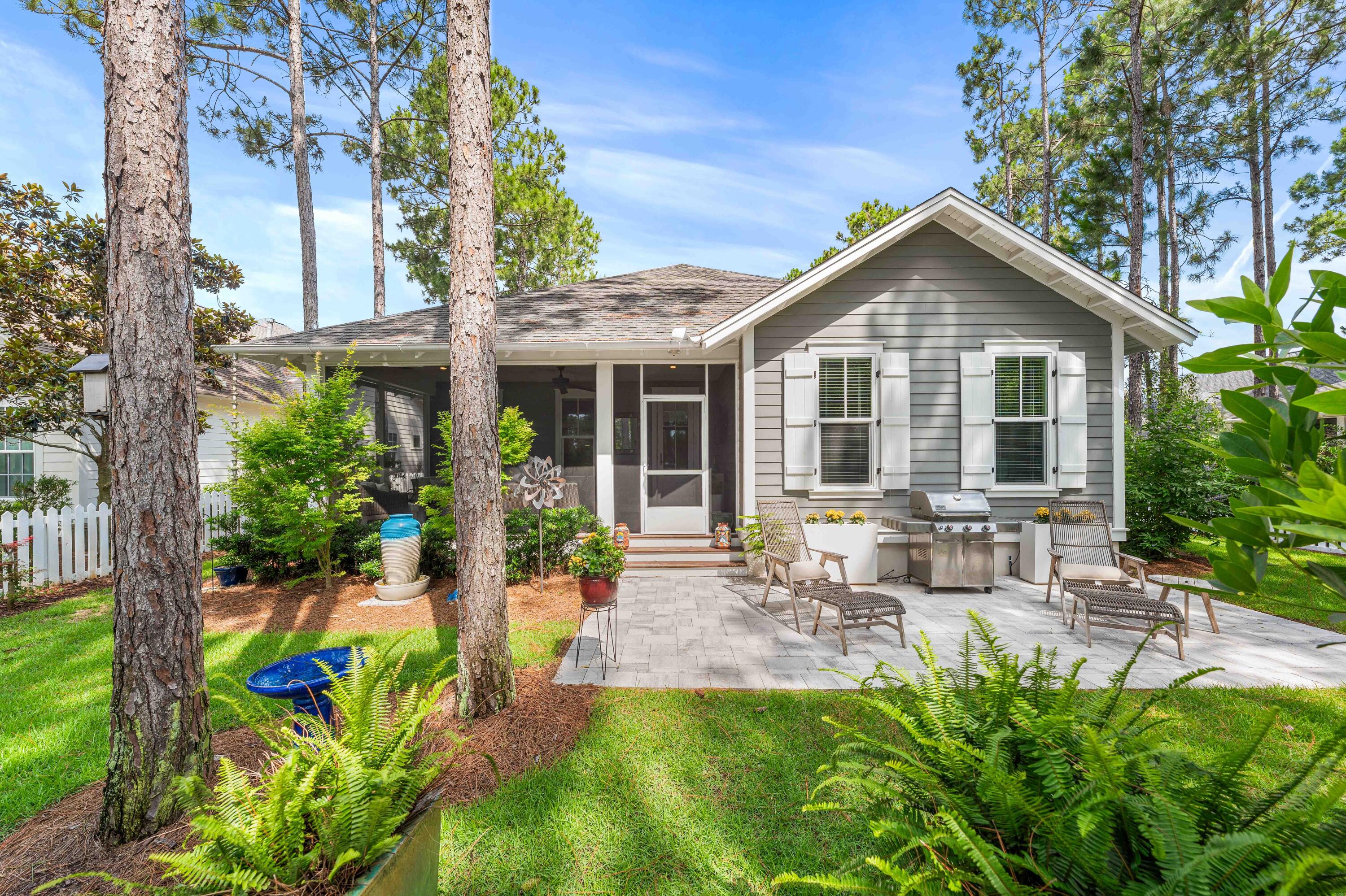 Welcome to the heartbeat of Watersound Origins! Tucked into a coveted Phase 1, Winter Garden location, this home is wrapped in natural beauty, with peaceful nature paths bordering two sides of the property, creating a complete sense of seclusion rarely found this close to the center of the neighborhood. This home is just a two-minute walk from your front door, to the community pool, golf course, and amenity center, making this home very accessible. Step on to the large screened-in back porch and experience something truly special; a serene, private setting backing onto the community park. The backyard feels like your own tranquil retreat, designed for seamless indoor-outdoor living.
This unique Edelweiss Plan features 4 bedrooms, 4 bathrooms, a separate enclosed office, and almost 2,500 square feet, of single-level ranch style living. Designed with both everyday comfort and entertaining in mind, this well-balanced floorplan will surprise you with large, comfortable room sizes throughout. 

The current owners have made numerous improvements including approximately $25,000 in professional landscaping and hardscape, gutters, a split HVAC system in the garage, and a new HVAC system installed in 2024. Olive and fruit trees complete the fenced in backyard. In the dining room, there is a custom dry bar complete with built-in cabinetry, wine fridge, cypress shelving and there is a Sonos system with speakers throughout the home. In the kitchen, there are pull out shelves and drawers were added to the closets in the bedrooms.

The spacious primary suite offers a large walk-in closet, soaking tub, and separate walk-in shower, additional bedrooms and enclosed office provide flexibility for guests, working from home, or growing families. The home has hardwood floors throughout. 

Watersound Origins residents enjoy a resort-style pool, fitness center, playground, tennis, pickleball, and additional sports courts. Residents also have dock access to Lake Powell, and miles of walking and biking trails. The renowned Origins Golf Course, is recognized as one of the top par-3 courses in the world. Nearby Watersound Town Center offers convenient access to dining, shopping, Publix, Starbucks, medical offices, and community events throughout the year. With no short-term rentals allowed, Watersound Origins offers a true sense of community while remaining just minutes from the white sand beaches of Inlet Beach and scenic Highway 30A. Home is sold unfurnished. Buyer to verify all information and dimensions. All TVs, gym equipment and mats in the garage, grill and outdoor chairs, along with the Sonos system are included in the sale.