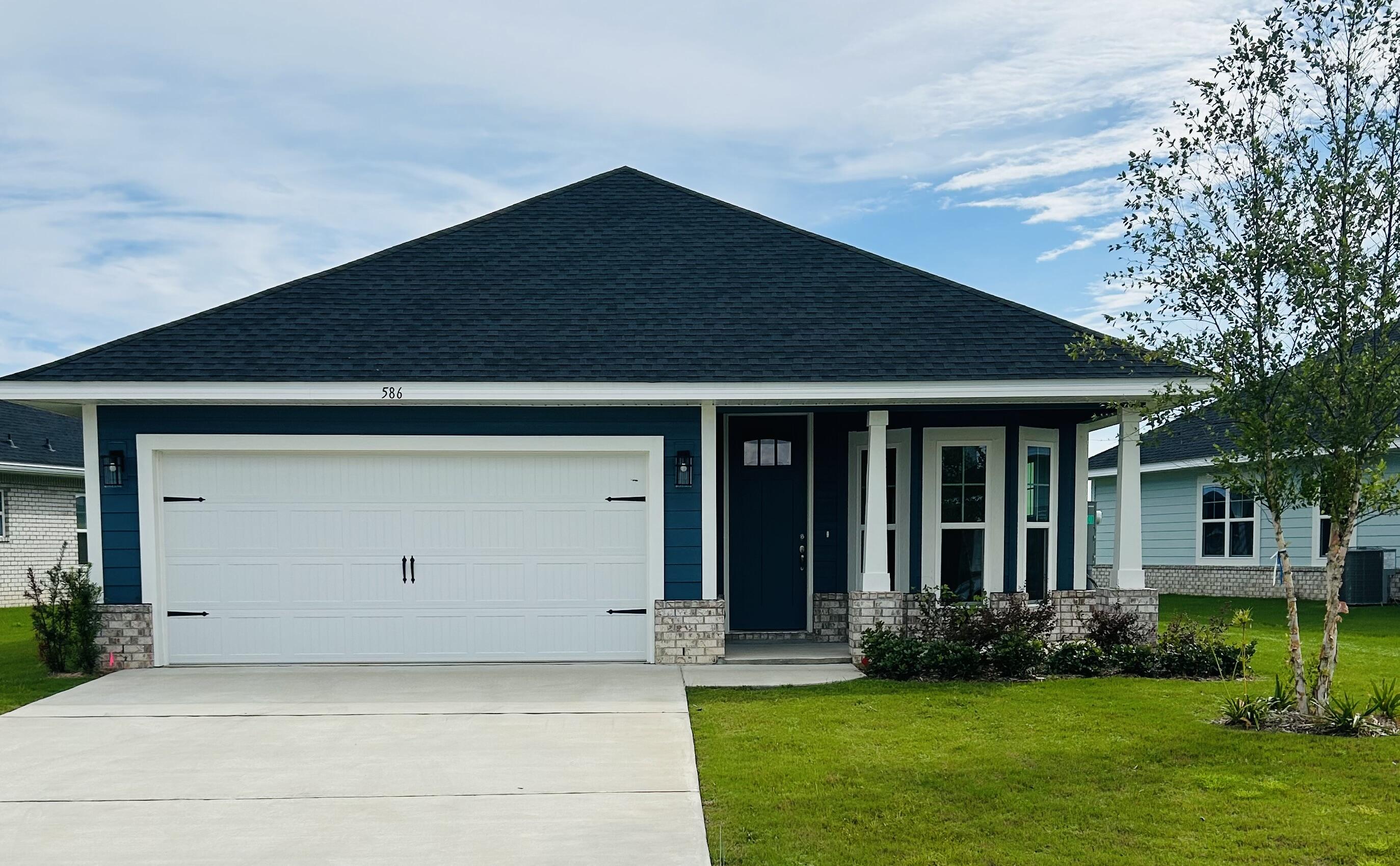 Limited-time offer: Receive up to $35,000 price discount on this home. Ask about our 3.99% interest rate buy down promotion with our preferred lender. Community also has USDA financing with zero down payment for those that qualify. 
THE BLUFFS is a new Freeport subdivision located just a 20 minute drive to South Walton beaches!  
Craftsman style, 3 BR/2 BA home with Hardiboard siding and brick skirt. The interior features 9' ceilings throughout, and 10' trey ceilings in the Living Room and Master Bedroom.  Bay window delivers a sunny dining /flex room.  8' entry doors, quartz countertops and durable CoreTec Pro Plus LVP flooring throughout.  Oversized owner's suite with large walk-in closet. *Some photos have been virtually staged to illustrate the property's potential.*