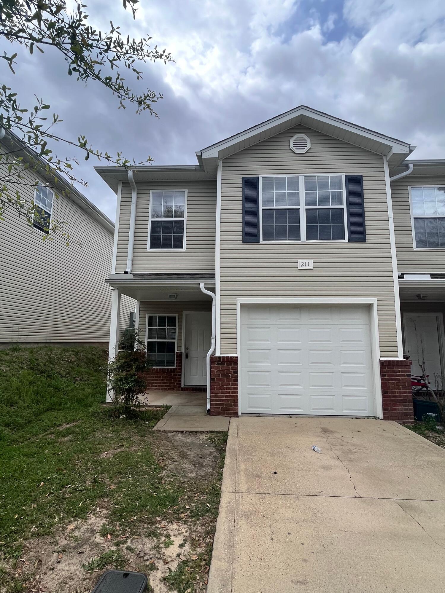 End unit with ceiling fans in living room and bedrooms, hard surface flooring downstairs, carpet in bedrooms. Master suite with a walk in closet and spacious bedrooms. Washer & dryer hook up. Lawn maintenance taken care of by owner.