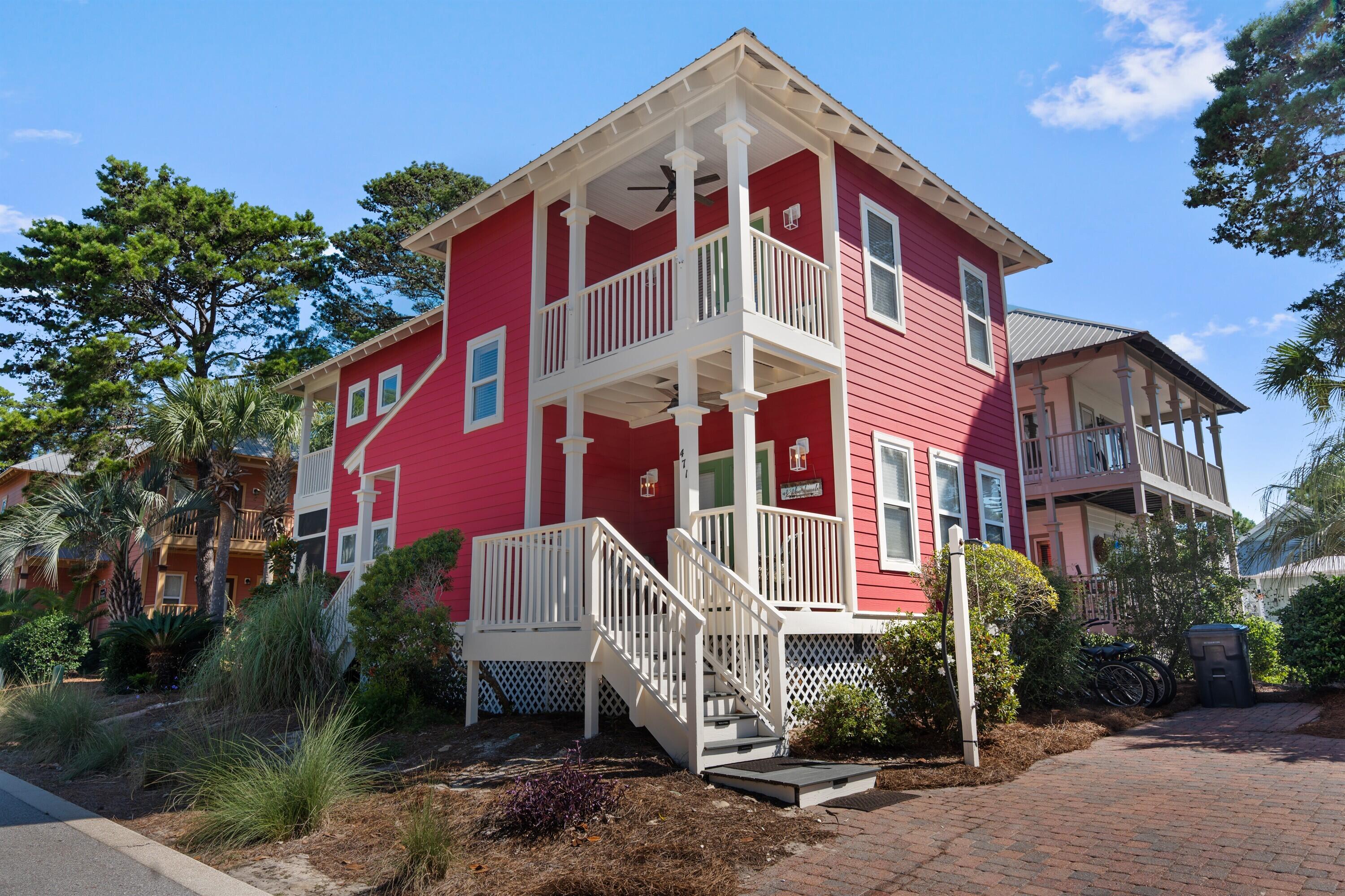 Fall in love with one of the best kept secrets along 30A - Old Florida Village! With just 75 homes nestled between palms and pools in this gated neighborhood, you'll fall in love with the colorful coastal cottages and close-knit community feel the moment you drive in. This two-story home is perfectly situated on a premium lot just steps from one of two pools and features three bedrooms, each with its own private porch. A sought-after screened porch allows for enjoying the outdoors in any weather, and the additional front porch is perfect for taking in relaxing mornings and breezy evenings. 

Full exterior Renovation!
All new Trex decking, new exterior lighting and stair lighting, new paint, wood replacement, new PVC fencing, and electric power added for golf cart!