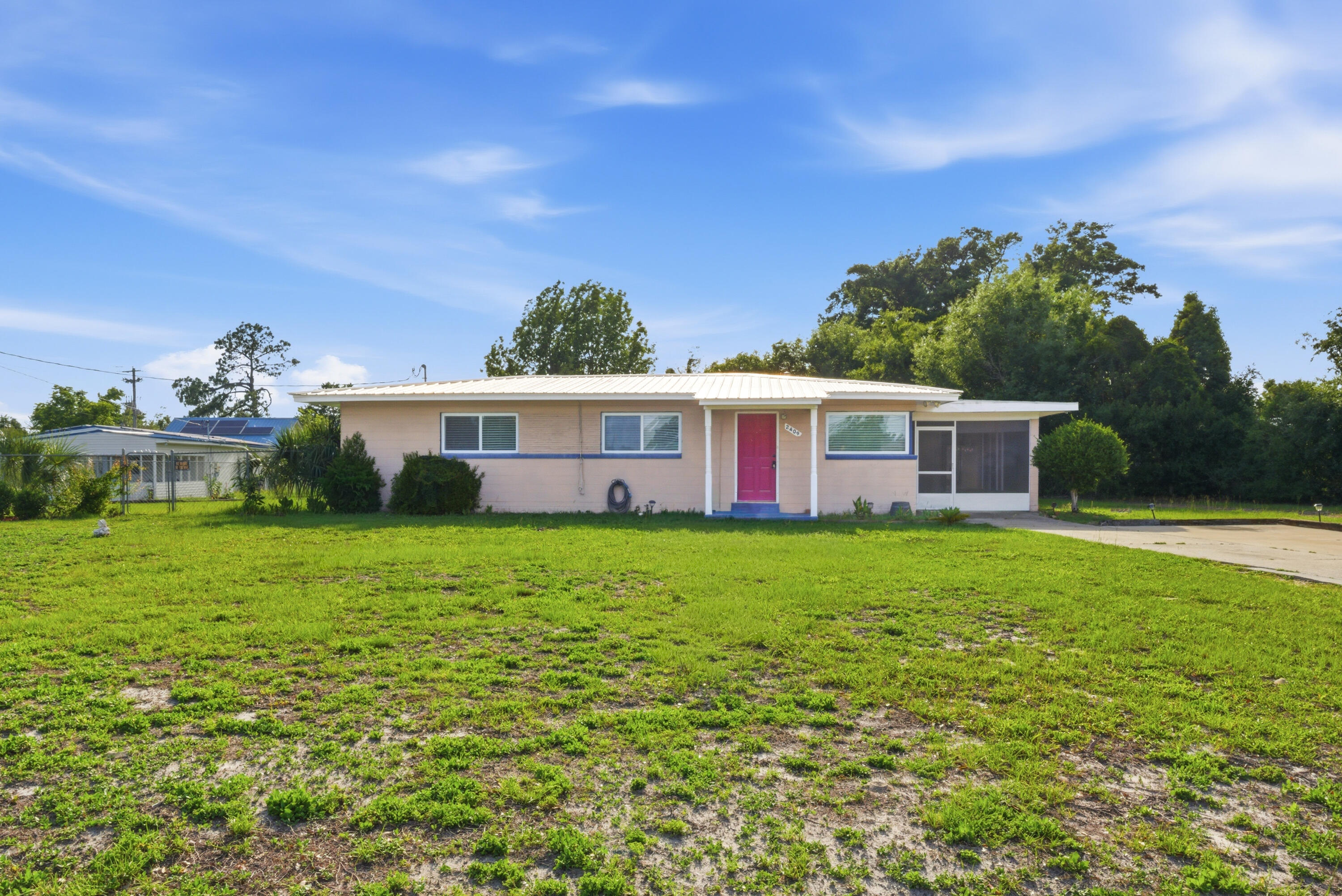 Fresh, clean, and move-in ready in the heart of Panama City! This updated home offers bright open living spaces, tile flooring throughout, and a functional layout designed for everyday comfort. The kitchen features granite countertops, white cabinetry, stainless appliances, and plenty of workspace for cooking and entertaining. Spacious bedrooms and updated bathrooms give the home a modern feel while maintaining a warm and comfortable atmosphere.

Step outside to a large screened patio overlooking the oversized backyard with room for pets, play, gardening, or future outdoor additions. A detached garage/workshop adds extra storage and flexibility for hobbies, tools, or recreational equipment.

Conveniently located near schools, shopping, dining, parks, and just a short drive to the beaches, this property offers the perfect mix of space, functionality, and location. Whether you're searching for a primary residence, first home, or investment opportunity, this property is ready for its next chapter.