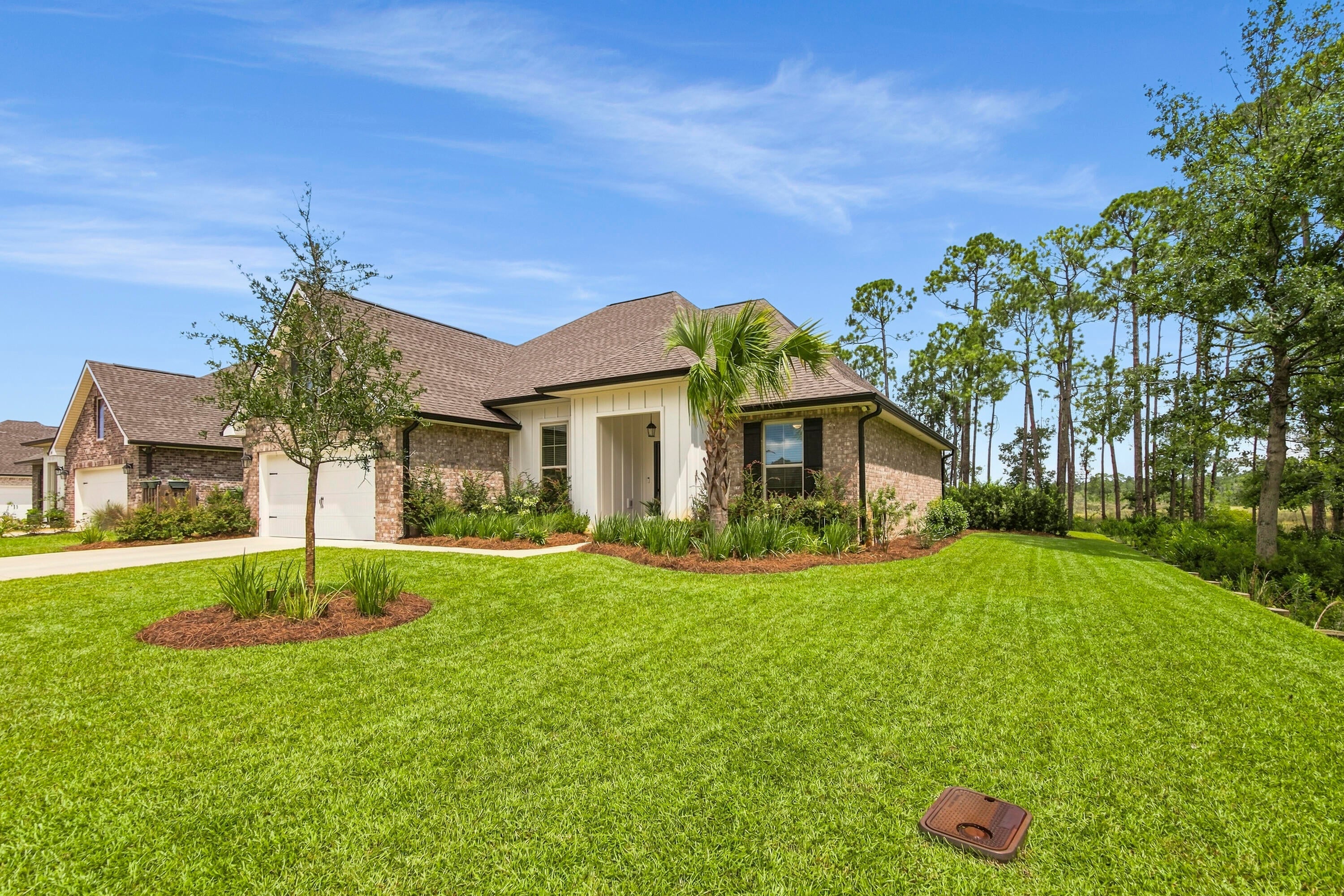Less than two years old, this 3-bedroom, 2-bath home in Starburst at Hammock Bay offers an open, split-bedroom floor plan with a dedicated office/den plus a built-in computer desk/niche by the laundry room. The backyard is the true highlight, offering direct access to the bay--fish or launch a paddleboard right from your own backyard! An outdoor sink makes cleaning the day's catch convenient, while the covered rear porch provides an ideal place to relax and enjoy the waterfront setting. Inside, the kitchen features a center island, walk-in pantry, recessed lighting and energy-efficient appliances. The spacious primary suite includes a tray ceiling, two walk-in closets, double vanity, garden tub and separate custom-tiled shower. Additional features include crown molding, a covered front porch, low-E vinyl windows, smart Wi-Fi thermostat, floodlights, architectural shingles and upgraded landscaping. Conveniently located near Hammock Bay's new Creekside Clubhouse and amenity center. The developer completed a Letter of Map Revision Based on Fill (LOMR-F) after development, and flood insurance is not currently required. Refer to the survey and supporting documentation. Buyers should verify flood-zone and insurance requirements with their lender and insurance provider. This nearly new home delivers modern comfort, exceptional outdoor living and the best of the Hammock Bay lifestyle. Schedule your showing today!