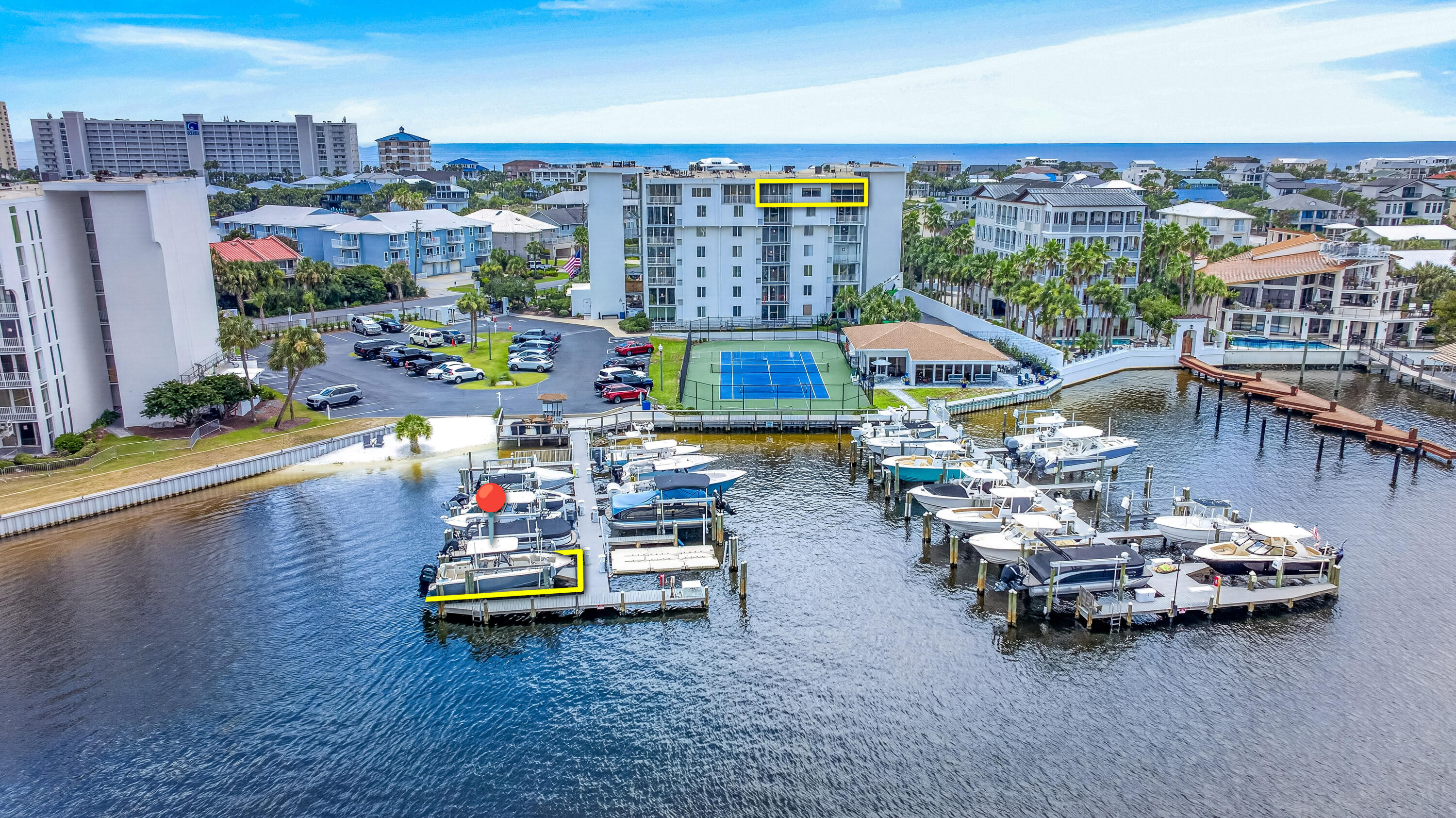 PENTHOUSE • FURNISHED• BOAT SLIP • HARBOR VIEWS! DEEDED BEACH ACCESS! Welcome to Dolphin Point Penthouse 703A, a premier west-corner residence located within the gated Holiday Isle community, Dolphin Point, in Destin, Florida. Offering 2,280 square feet, this spacious two-bedroom, two-bath condominium (with an additional flex room), features one of the largest floor plans in the complex, sweeping harbor and marina views, and exceptional indoor-outdoor living.
Meticulously appointed throughout, the residence showcases cherrywood cabinetry and custom built-ins, granite countertops, tray ceilings, upgraded electrical components, updated systems, and enhanced appliances. The third bedroom is currently configured as a home office, providing flexible space for guests, work, or additional living needs. Enjoy morning coffee and spectacular evening sunsets from the private primary-suite balcony overlooking the marina and tennis courts. A large exterior storage room conveniently located on the seventh floor is also included.
The residence conveys with deeded 32-foot Boat Slip #27, equipped with a 10,000-pound lift. A 2022 Key West 263 FS is also available separately.
Dolphin Point offers an impressive collection of waterfront amenities, including a seasonally heated swimming pool, waterfront clubhouse with full kitchen, grilling area, tennis and pickleball courts, marina, paddleboard and kayak storage, deeded community beach access, elevators... available golf-cart parking, water-taxi access, and 24-hour security.
Current building improvements are in process that should be complete at the end of August 2026. Seller is a licensed real estate salesperson in the state of Florida. Please call to coordinate your showing today.