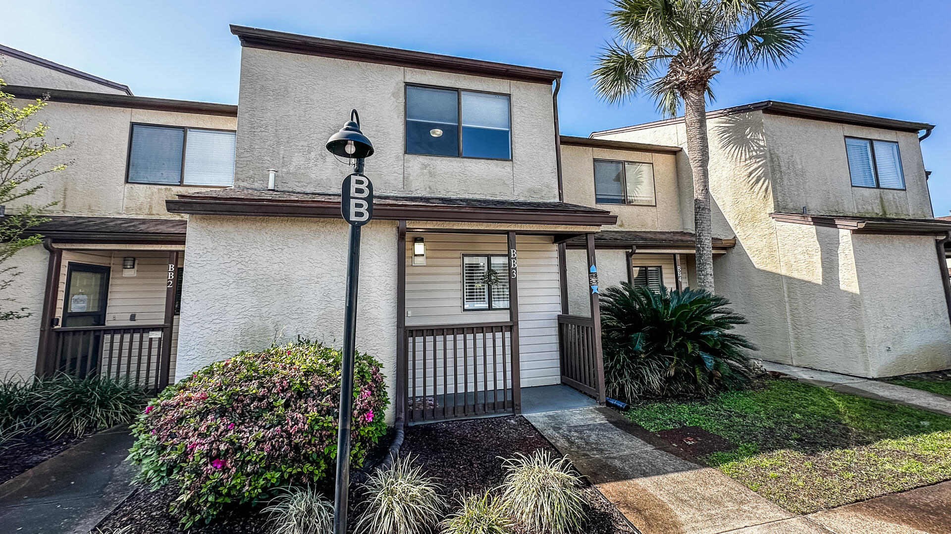 Welcome to Portside BB3 and start living the beach life in this completely remodeled unit in 2022/2023.There was not one thing that was looked over to make BB3 a WOW factor . Popcorn ceilings smoothed throughout and the entire unit repainted. The kitchen was expanded to allow two people to use the space. New cabinets, quartz counter tops and new stainless appliances. The pantry was rebuilt and turned from the hallway into the kitchen. Soft closing shelves installed all behind a water cascading glass door. Plantation shutters installed in the kitchen, living area and master bedroom. Can lighting installed along with new ceiling fans. A humid stat ( HALO) was added to the air handler to help control humidity in the unit. The space designated for the washer/ dryer was reconfigured for a stackable set thus allowing custom built shelves for supplies and storage. New laminate flooring installed throughout. A carpet runner was installed on the steps going upstairs. The master bedroom has a queen bed against a wood trimmed accent wall. Two closets that were customized to increase storage space. Off the bedroom is a large deck rebuilt in 2024, with a beautiful view of the landscaped area behind the unit. Additionally there is a privacy screen and ceiling fan to allow spending time outside year round. The master bathroom was also remolded to include a soaking tub thus allowing the owners a true full size master bath. The guest bedroom comes with two new full size beds against a trimmed accent wall. Two closets customized to increase storage space. In the upstairs hallway a heavy duty 350 lb. pull down attic access was added. The attic space had additional insulation added and the deck space was floored allowing for a large amount of storage space for the owners." On the main level back porch, a swing was added to relax in, and the storage closet was finished out to maximize the space for all those beach toys. There is an outdoor shower also in place to help rinse off before going inside after a day at the beach, pool or early morning pickleball at Portside . Portside has three pools, the upper pool is heated during the winter months. The community is dog friendly with several open spaces to walk and play with your pet(s). There is a fitness area and a clubhouse. The clubhouse includes restroom facilities, a pool table, ping pong table, darts and both a library and DVD section. The clubhouse is available for events. Come out and see what Portside has to offer on the quiet west end of the beach.