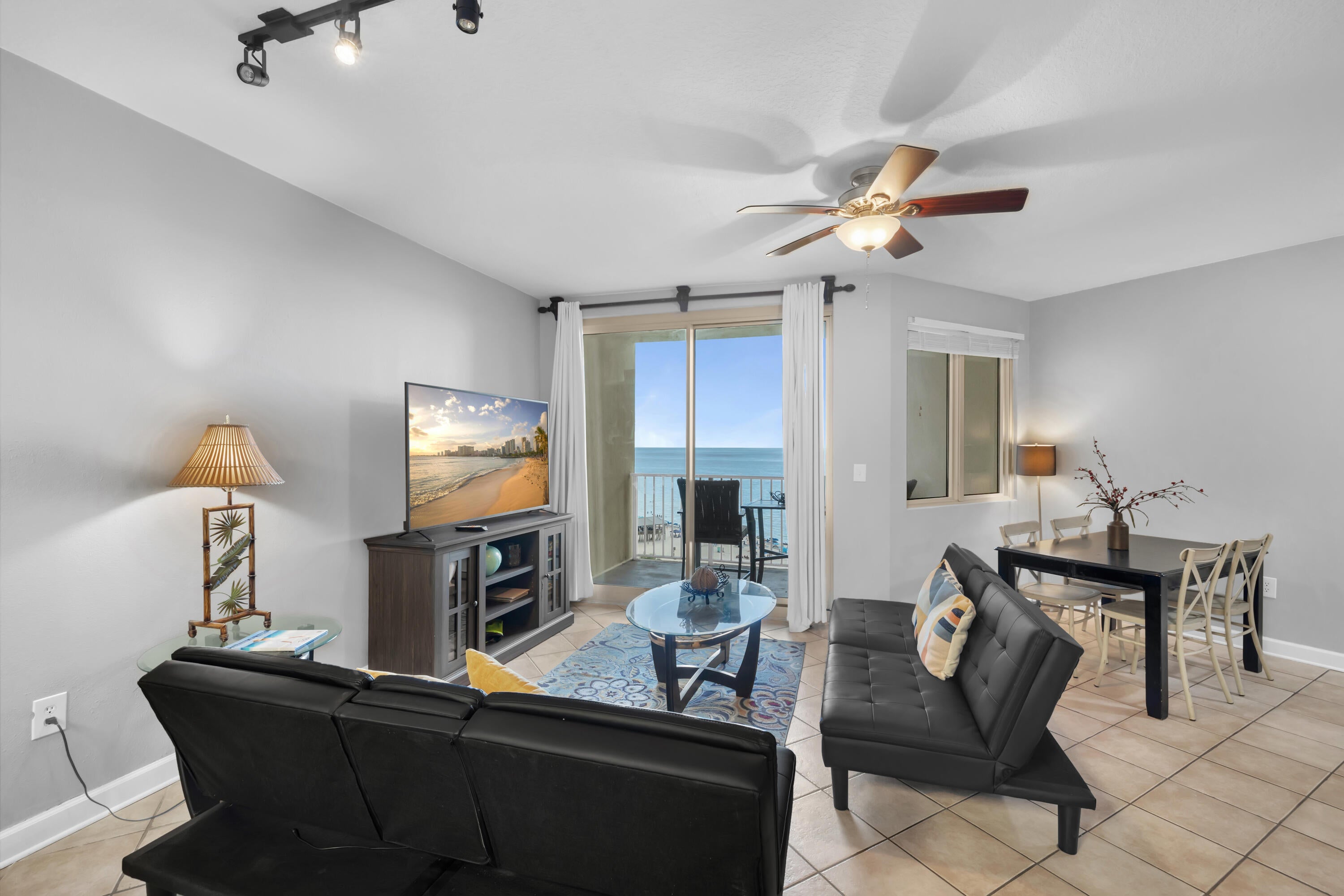 SAME-LEVEL LEASED PARKING. BUNK ROOM WITH A DOOR. FRESHLY PAINTED. Shores of Panama 1010 is a fully furnished, 10th-floor Type F floor plan featuring one bedroom, an enclosed bunk room, one full bathroom, and one half bathroom. Tile flooring extends throughout the unit. The bunk room includes a door for separation from the main living area, an uncommon feature within this stack.
The kitchen features Ubatuba granite countertops, updated cabinet hardware, and a stackable washer and dryer. The primary bedroom includes a king-size bed, and flat-screen televisions are located in the primary bedroom, bunk room, and living room. The freshly painted interior is furnished for continued rental use.
The leased parking space is located shortly after entering the 10th-floor parking level, providing covered, same-level access to the unit without changing floors.
The corner balcony overlooks the lagoon-style pool and surrounding resort grounds. Additional equipment details include a 2015 water heater and the original HVAC system.
Shores of Panama is a Gulf-Front resort centered around an expansive zero-entry lagoon-style pool with palm-lined islands, fountains, and a large outdoor hot tub. Additional amenities include private beach access, an indoor heated pool and hot tub, a 24-hour fitness center, a seasonal poolside Tiki bar, and covered parking. Located in the heart of Panama City Beach, Shores of Panama is adjacent to Pineapple Willy's and directly across from Laketown Wharf, offering nearby dining, shopping, and entertainment. Additional Panama City Beach attractions include Pirates Voyage Dinner & Show, Topgolf, McGuire's Irish Pub, and Tootsie's Orchid Lounge.
HOA dues are currently $3,507.11 per quarter. One special assessment installment remains in the amount of $1,218.04, due in the fourth quarter of 2026. All information is deemed reliable but not guaranteed; buyer to verify if important.