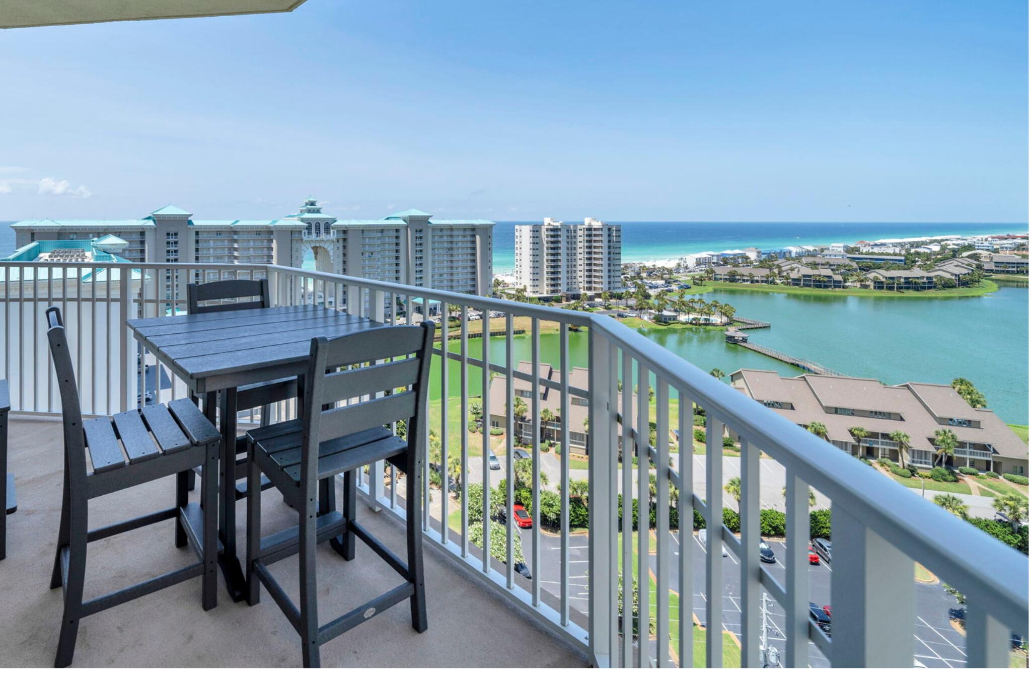 One of only a handful of west-end Corner units in Ariel Dunes I, this spacious 3 Bed / 3 Bath 14th-floor residence offers a view that simply cannot be duplicated! The expansive wraparound balcony showcases emerald Gulf waters, resort lake, and unforgettable sunsets all the way to the Destin bridge, while the second balcony off the guest bedroom overlooks the bay, golf course and Seascape's exciting new entertainment districts. Natural light pours through walls of windows highlighting the recently updated interior featuring beautiful LVP flooring, a custom built-in bar, stylish coastal furnishings, and an open-concept floor plan that's completely turnkey for vacation rentals, a second home, or full-time coastal living.  Located within the gated Seascape Resort, owners enjoy easy access to sugar-white beach, an 18-hole golf course, multiple pools, gym, an active tennis and pickleball community, walking and biking trails, on-site dining/ shopping and the vibrant Seascape Towne Centre all without leaving the resort.