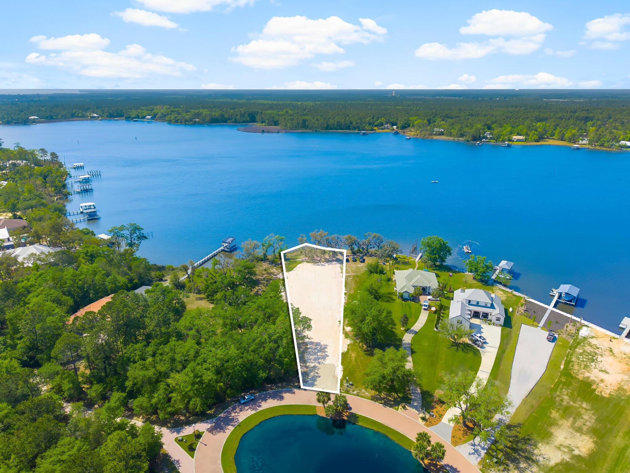Deep Water Lot with approved dock and house plans! Lagrange Cove is a true hidden gem on the bay.  Beautiful trees, Gated, neighborhood fountain, neighborhood fishing pond, and every lot is waterfront.  Deep water in Lagrange Bayou.  Easy access to the bay and the gulf.  This lot is cleared, graded, and ready to build.  House plans available to view.  The very best lot in Lagrange Cove with big water views.  Build your dream waterfront home.  Boat dock has already been approved, electric power pole has been set and paid for.  Current house plans are Geoff Chick designed.  Plans are negotiable with approved offer.