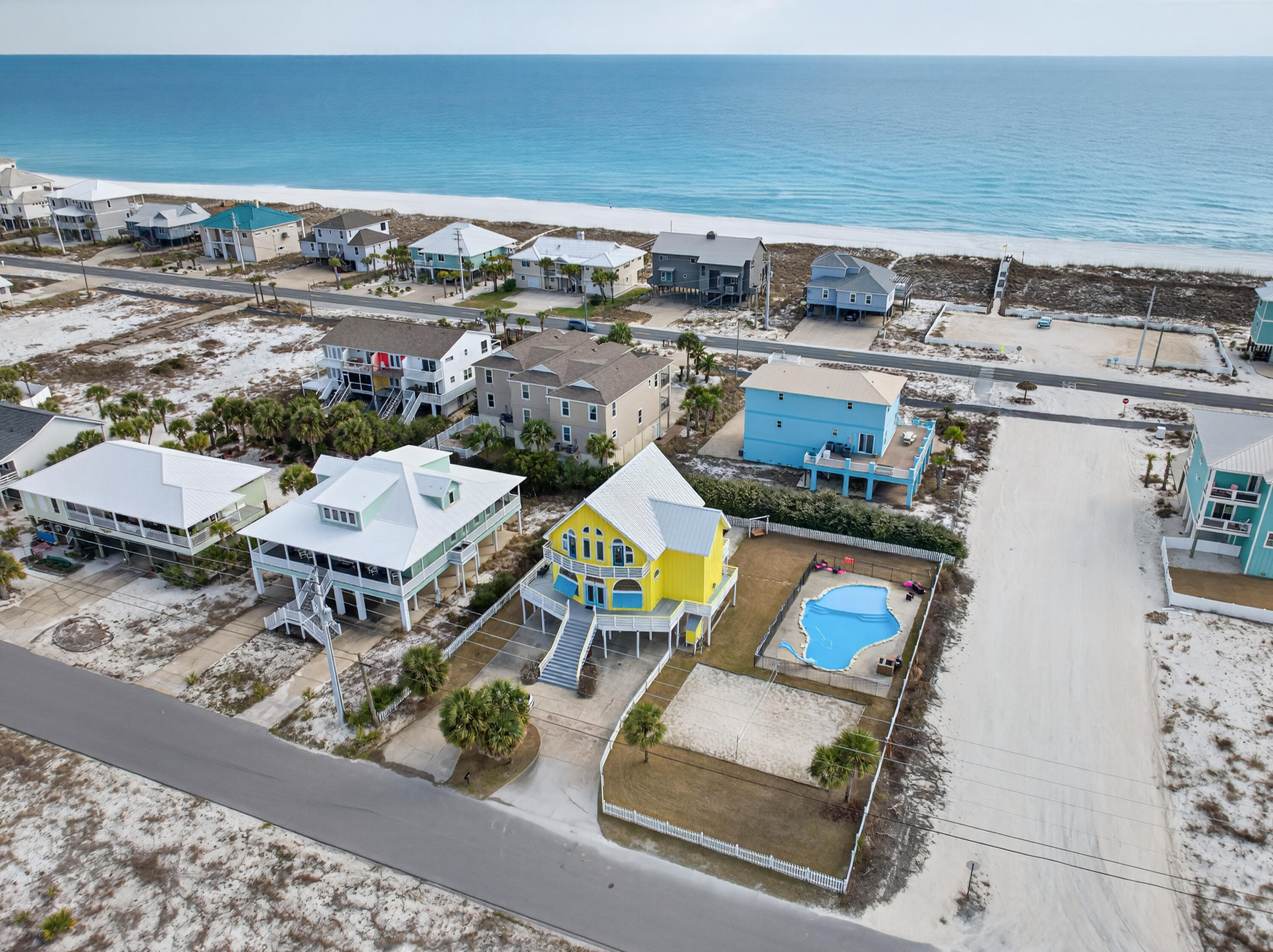 One of a kind Navarre Beach mini resort home 4Bedroom/3 Bath with the Bonus 4th bedroom/studio setup on private floor 
Tropical In ground private pool with a slide! Mini Golf Putter course
 Volleyball court, outside shower, 
There's no need to leave for activities. 
expansive windows allow great views of the Santa Rosa Sound, The kitchen has a double oven, plenty of cabinets huge center island featuring granite and tile backsplash. An expansive staircase leads to the 2nd level to the main suite, and a private deck with magnificent views of the Gulf.  Located on an oversized corner lot across from one of the Gulf access areas this house has great views of both the Gulf and the Sound.
Perfect beach retreat home for personal enjoyment or a wonderful business investment for investors income producing property and established wedding venue will transfer with the sale if buyer is interested in future bookings with everything set in place for seamless transfer. Rental management with prices that are unbeatable, Website, vendors, the works etc.  Private appraisal and pre inspection list have been completed and prepared for a well-balanced positioning on the market to be a quick and easy transaction. 

Currently sleeps 16

1 Your Private Beach Oasis
A resort-style primary or second home where every day feels like vacation.

2. A Turn-Key Income Producer
A proven short-term rental with established management already in place.

3. The Perfect Hybrid
Stay when you want. Rent when you don't. Let the beach work for you.


An optional wedding venue business may convey Bookings can easily be moved or transferred to new owner for 2026 all bookings transfer if buyer wishes. You will start out immediately having income on the books.

Gas Fireplace on premises but capped off for owner preference and option to have Gas Stove is very feasible at this property, 
Comes Fully Furnished or can be cleared out easily per buyer's request.