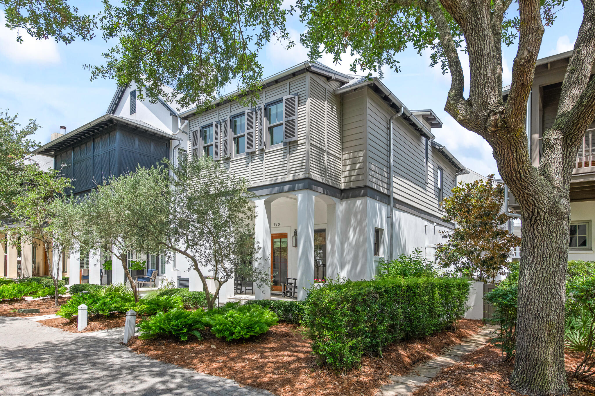 A classic and charming coastal home located in the heart of Rosemary Beach. This exquisite and pristine residence with garage and carriage house was designed by architect Frank Greene. As you enter the home from the front porch you are welcomed into an inviting open living, dining and kitchen area, with an abundance of light and exposed beams. A gas fireplace in the dining area creates a warm, cozy feeling. Large kitchen marble island and designer lighting are just some of the amazing elements of this space. As you approach the second floor, you will notice the incredible custom washed pecky cypress wood wall, and the beautiful red stained glass windows that were rescued from an old home in Louisiana. This floor hosts the master bedroom with private en-suite bath, along with the two additional guest bedrooms. The peaceful and private courtyard encompasses a lounge area, summer kitchen, wood burning fireplace and water fountain features. This is one of the most charming courtyards in Rosemary. The outdoor space includes access to the carriage house located above the garage. The carriage house offers an open living, dining and kitchen space with 2nd story private bedroom and bath. This delightful space also has 2 small built-in beds in the living area that can be closed off for privacy. This immaculate residence has been lovingly and meticulously cared for with notable attention to detail. Rosemary Beach embraces the principles of traditional town planning with a pedestrian friendly design. Allow us to say welcome home... you'll be happy to be here!