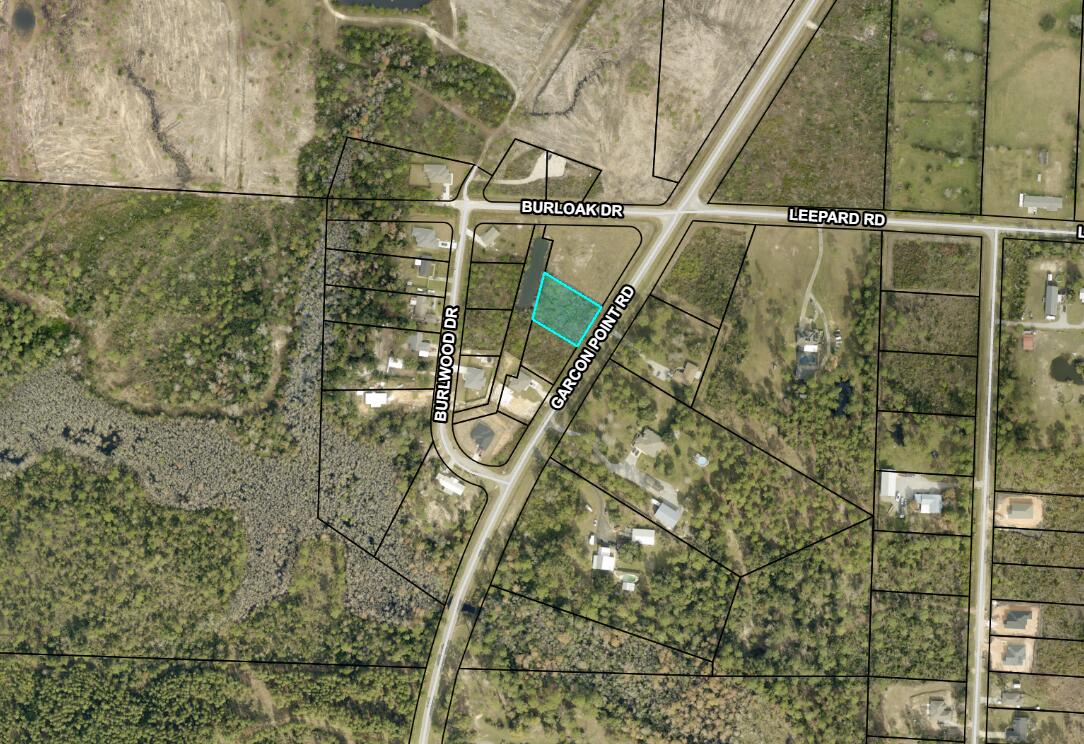Discover the perfect opportunity to build your dream home on this beautiful, buildable lot in the desirable Garcon Point area. Ideally situated just a short drive from the white-sand beaches of the Gulf Coast and conveniently located for commuters, this property offers quick access to Pensacola and an easy drive to Crestview. Enjoy the best of both worlds--peaceful surroundings with natural Florida beauty, while remaining close to shopping, dining, and everyday conveniences. The lot provides a great setting for a primary residence, vacation home, or investment property. With nearby access to Garcon Point Bridge and major roadways, you can be at the beach, in downtown Pensacola, or heading north toward Crestview with ease. Whether you're looking to build now or hold for the future, this property offers excellent potential in a growing area. Don't miss your chance to secure a slice of Northwest Florida living in a location that truly delivers on convenience and lifestyle.  .487 acres in on Garcon Point zoned R1 single family only.  No, you may not split any further. Setbacks F / R 25' S 15. Modular homes are allowed. No manufactured. See photos for pertinent GIS information. Not in Flood Zone. No flood insurance required . Public water and septic needed Tap fees due